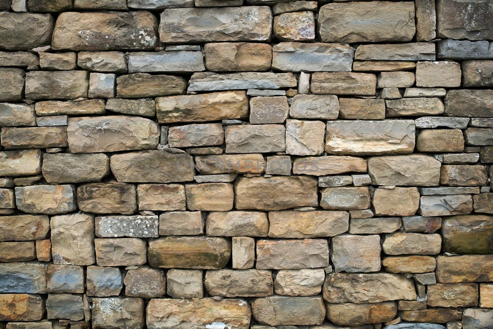 Texture of a stone wall. Old castle stone wall texture background. Stone wall as a background or texture. Part of a stone wall, for background or texture