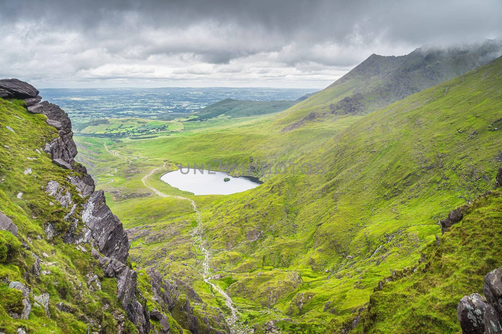 Panoramic view from Devils Ladder, one of most difficult trails, that is leading to highest Irish mountain Carrauntoohil in Ring of Kerry, Ireland