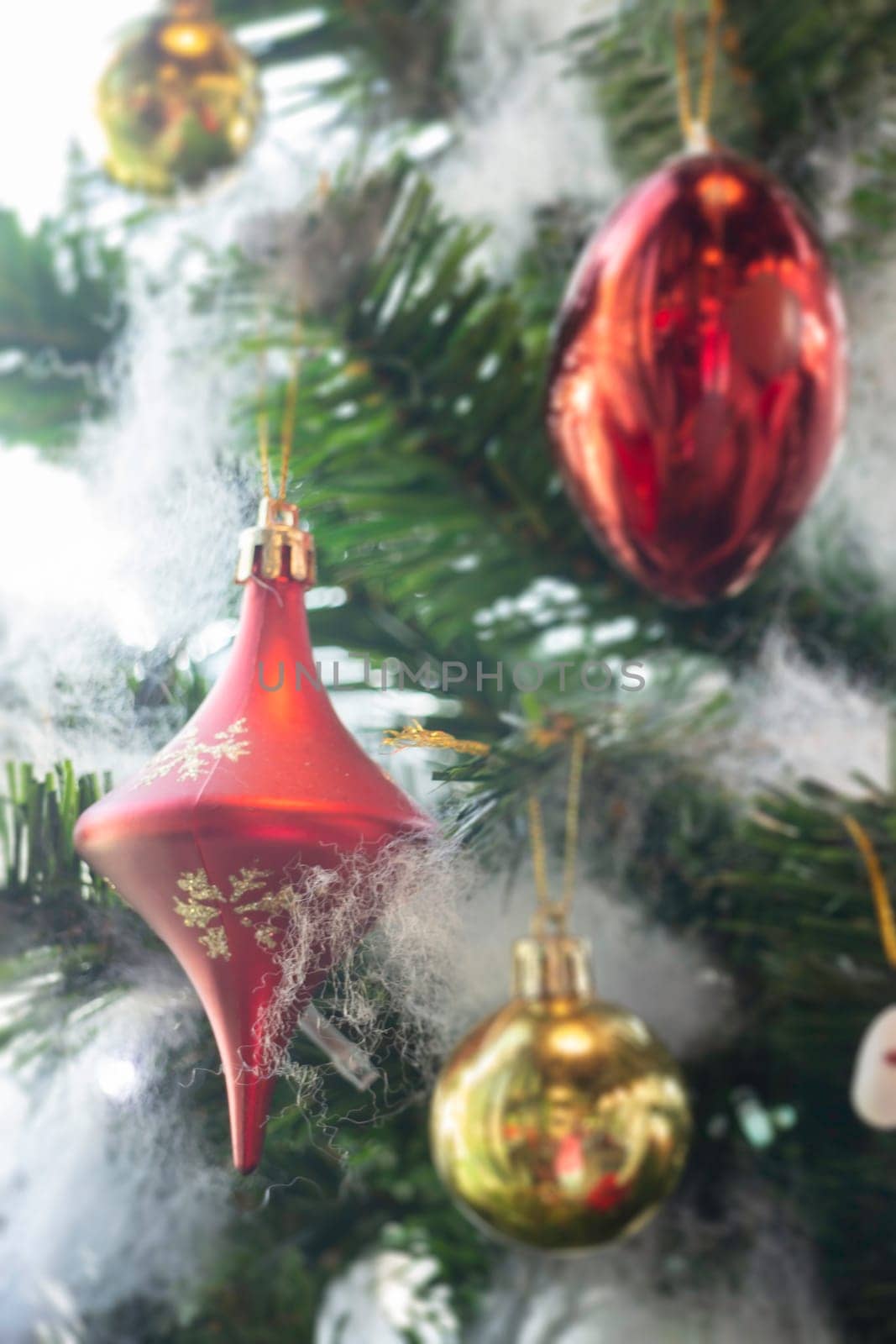 Christmas tree ornaments defocused lights background, stock photo