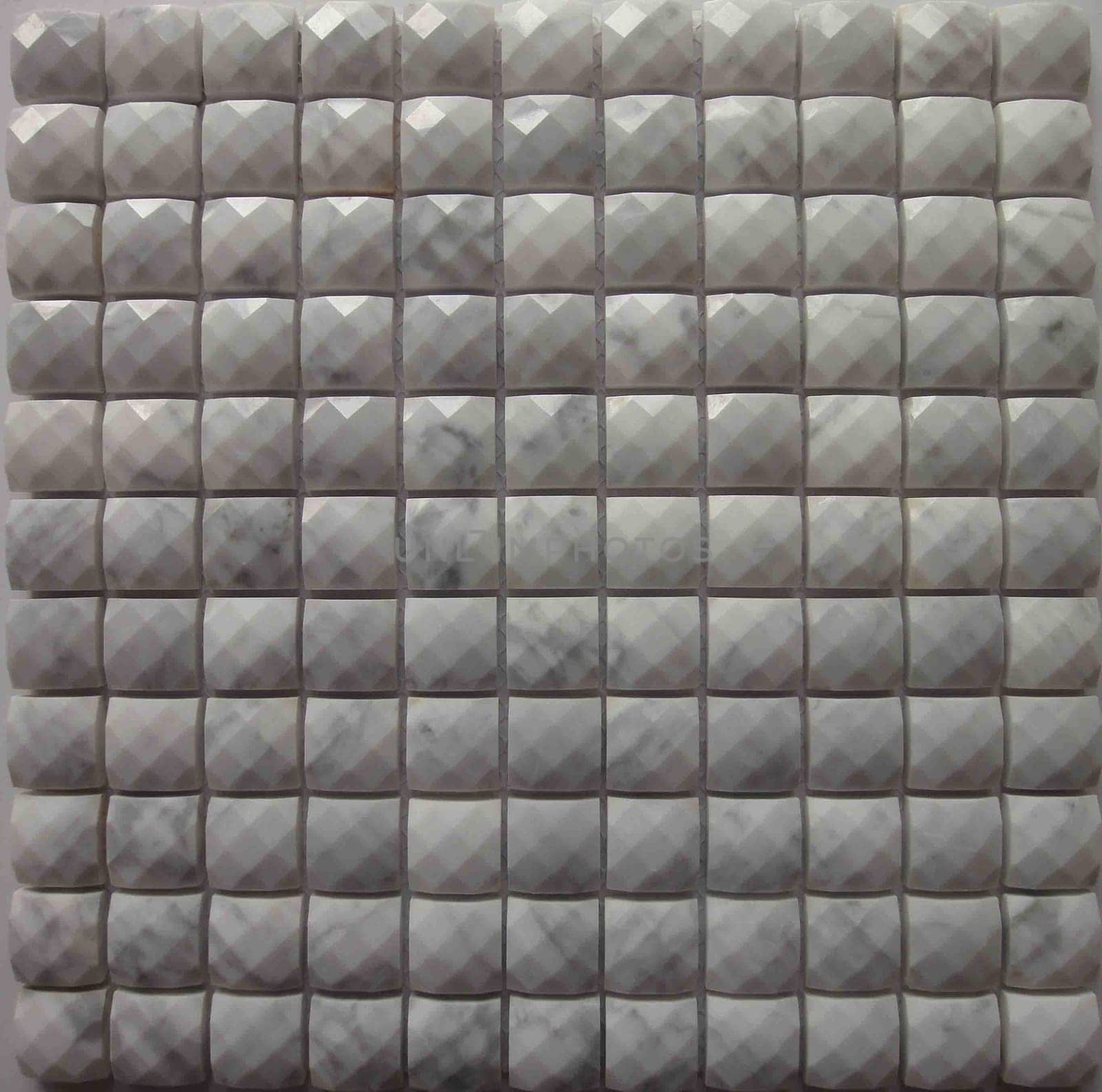 The background is the texture of the tile. The pattern and texture of the tile is construction.