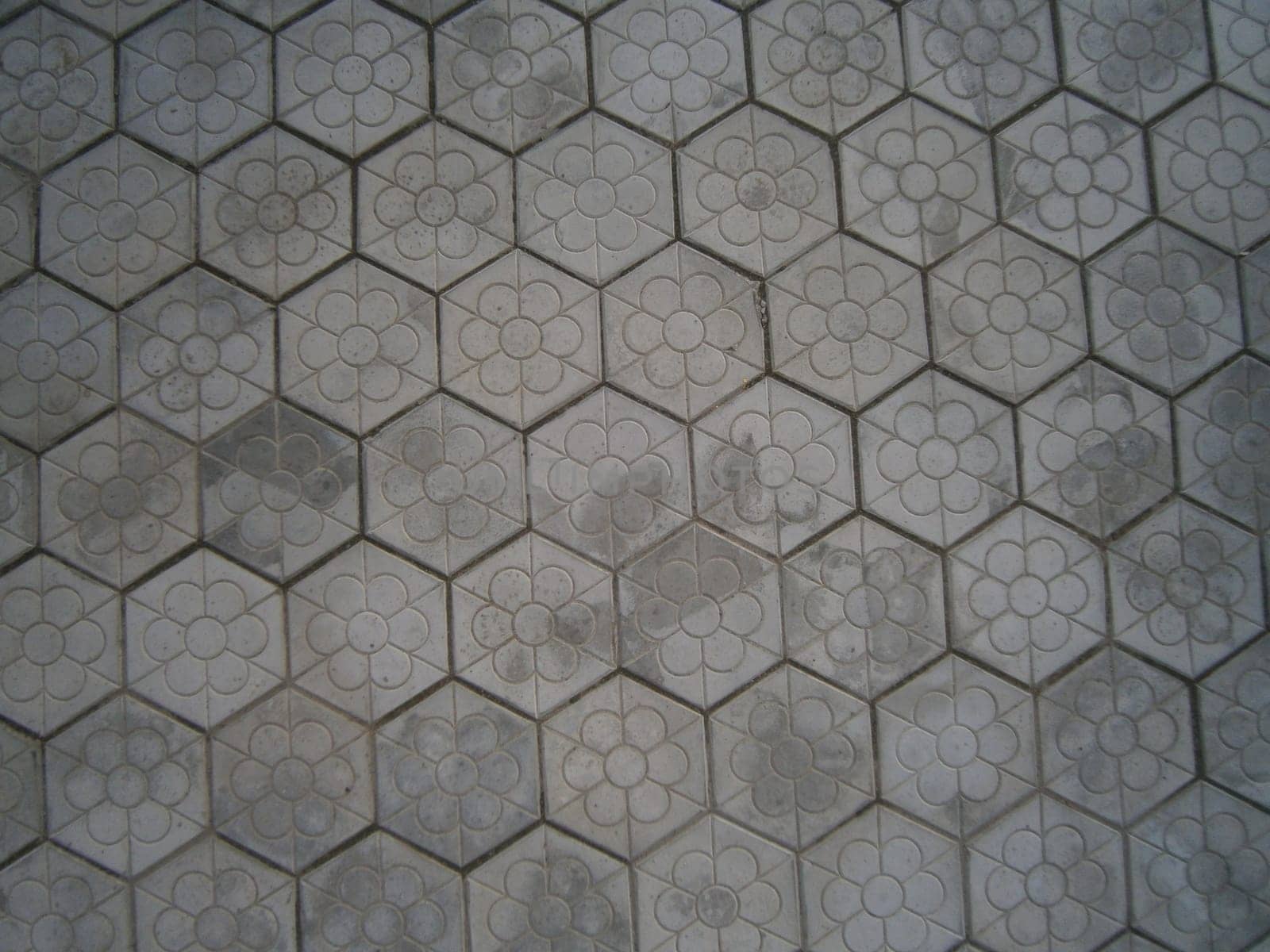 The background is the texture of the tile. The pattern and texture of the tile is construction.