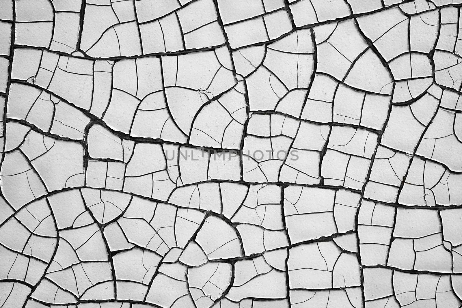 Cracks in the paint coat on a facade