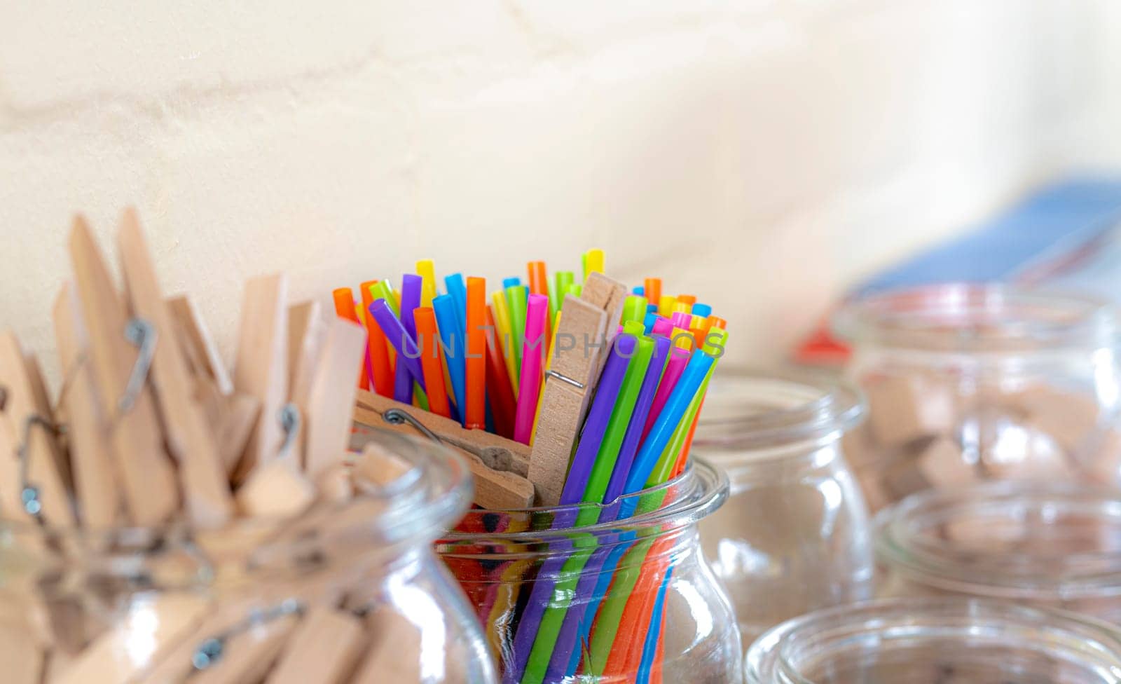 Colorful drinking straws and clothespins as a calculation aid in a primary school with copy space