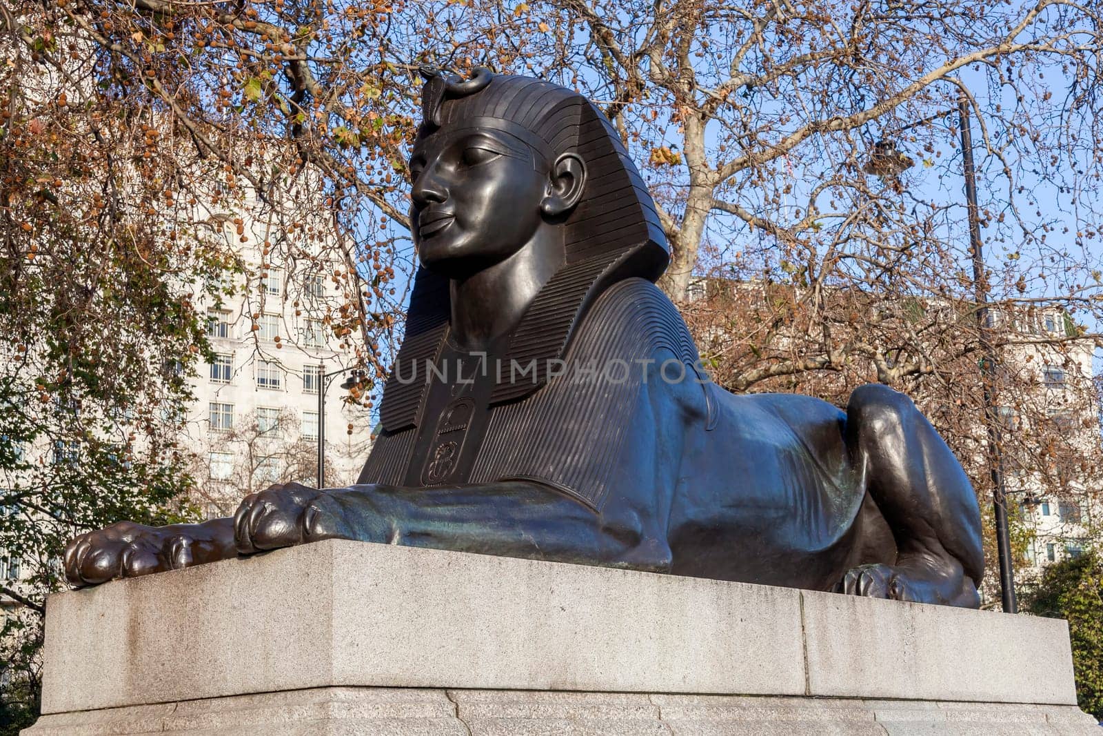 One of two Sphinx guarding Cleopatra's Needle on Victoria Embankment in London England UK erected in 1878 and is a popular tourist travel destination attraction landmark, stock photo image