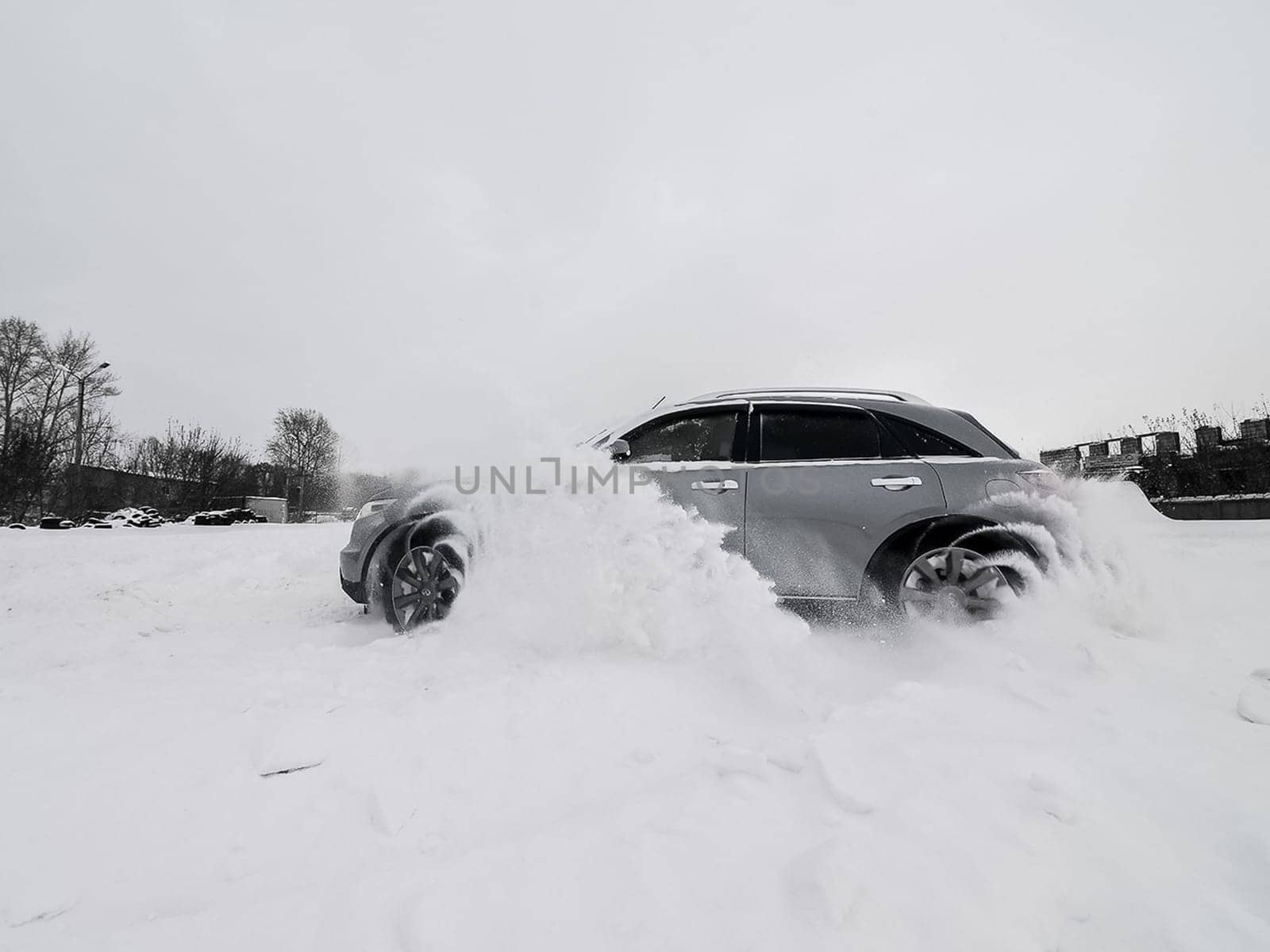 Moscow, Russia - January 24, 2019: Car infiniti QX70, winter photos of the car when driving through snowdrifts.
