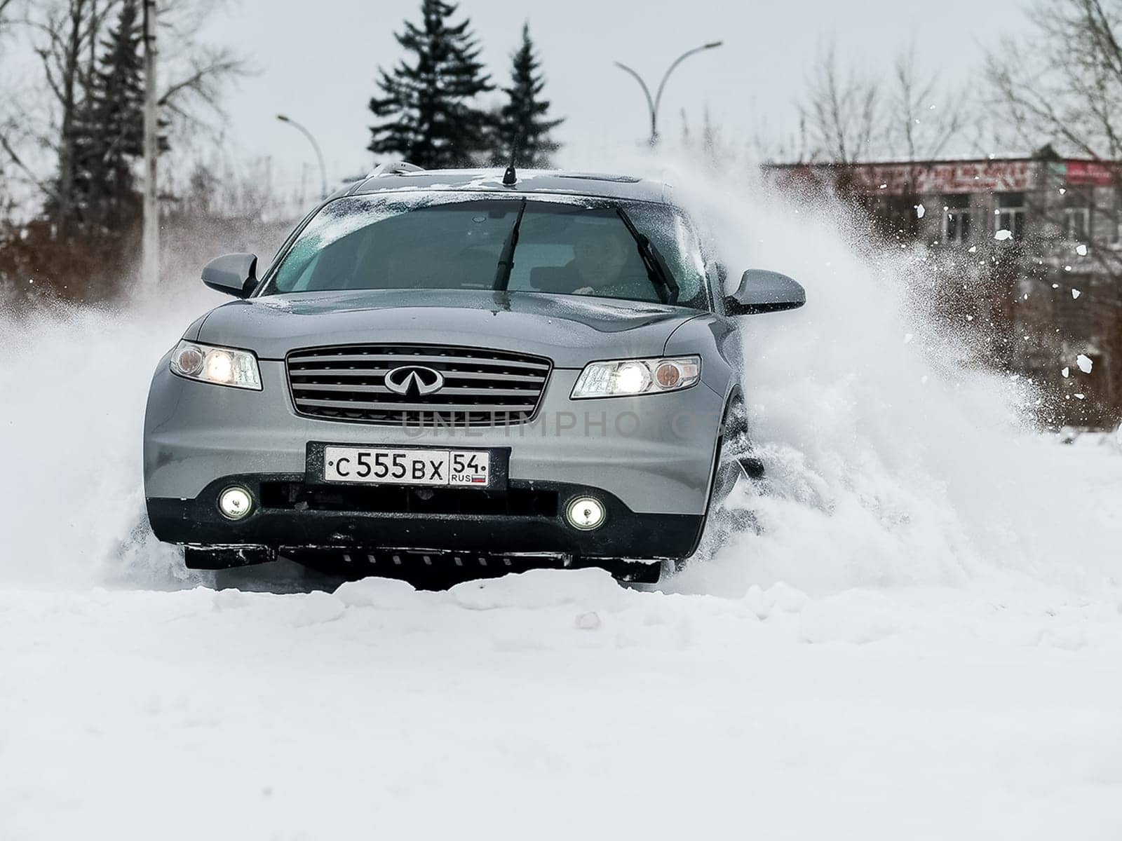 Moscow, Russia - January 24, 2019: Car infiniti QX70, winter photos of the car when driving through snowdrifts.