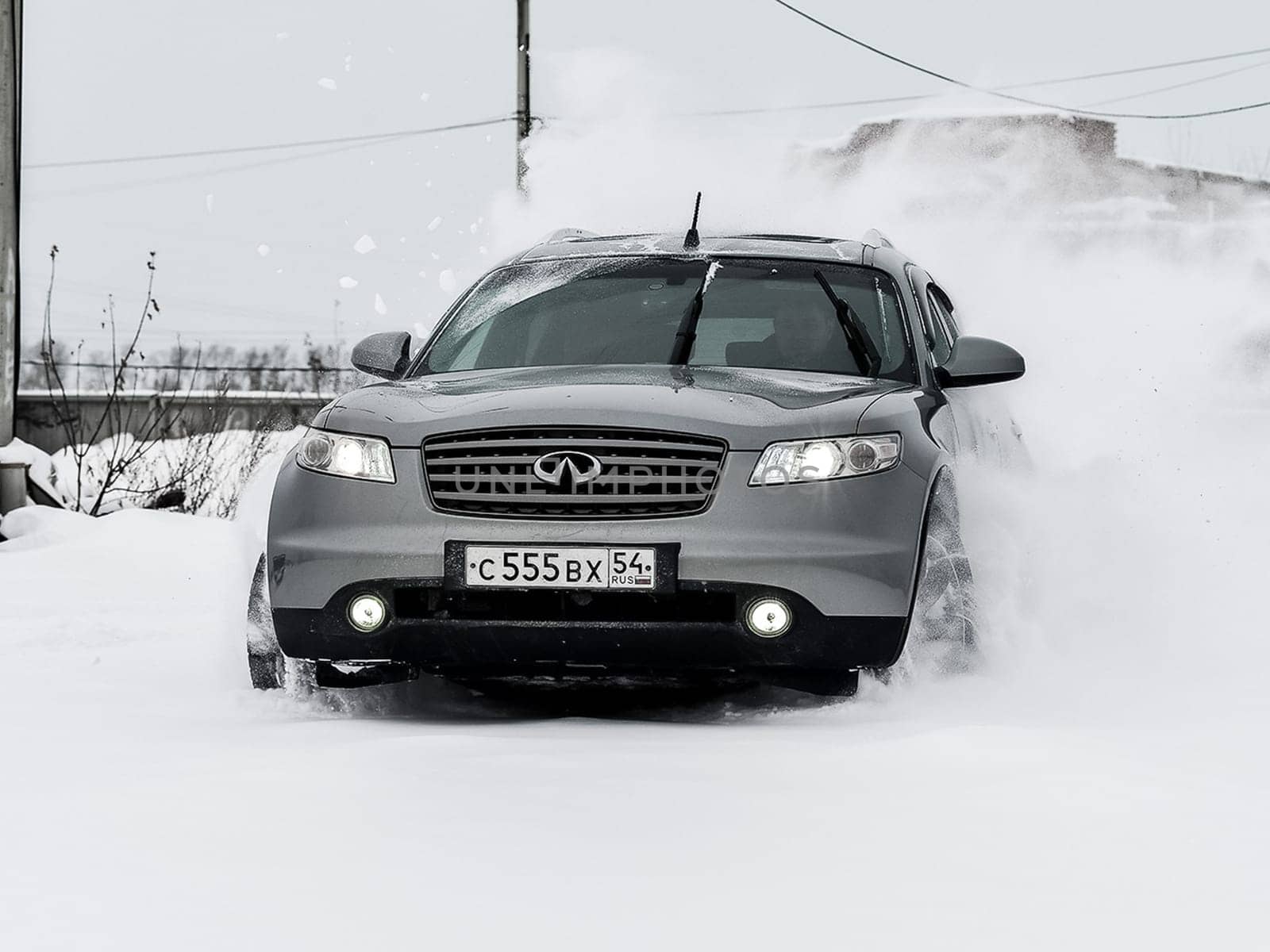 Moscow, Russia - January 24, 2019: Car infiniti QX70, winter photos of the car when driving through snowdrifts.