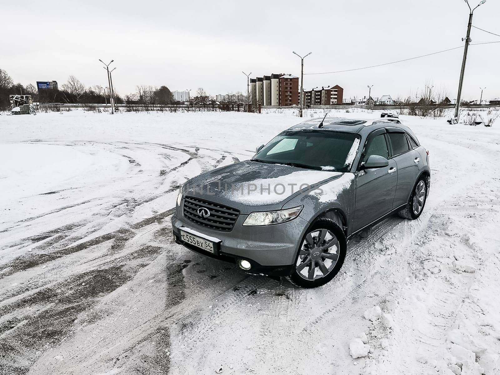 Moscow, Russia - January 24, 2019: Car infiniti QX70, winter photos of the car when driving through snowdrifts.