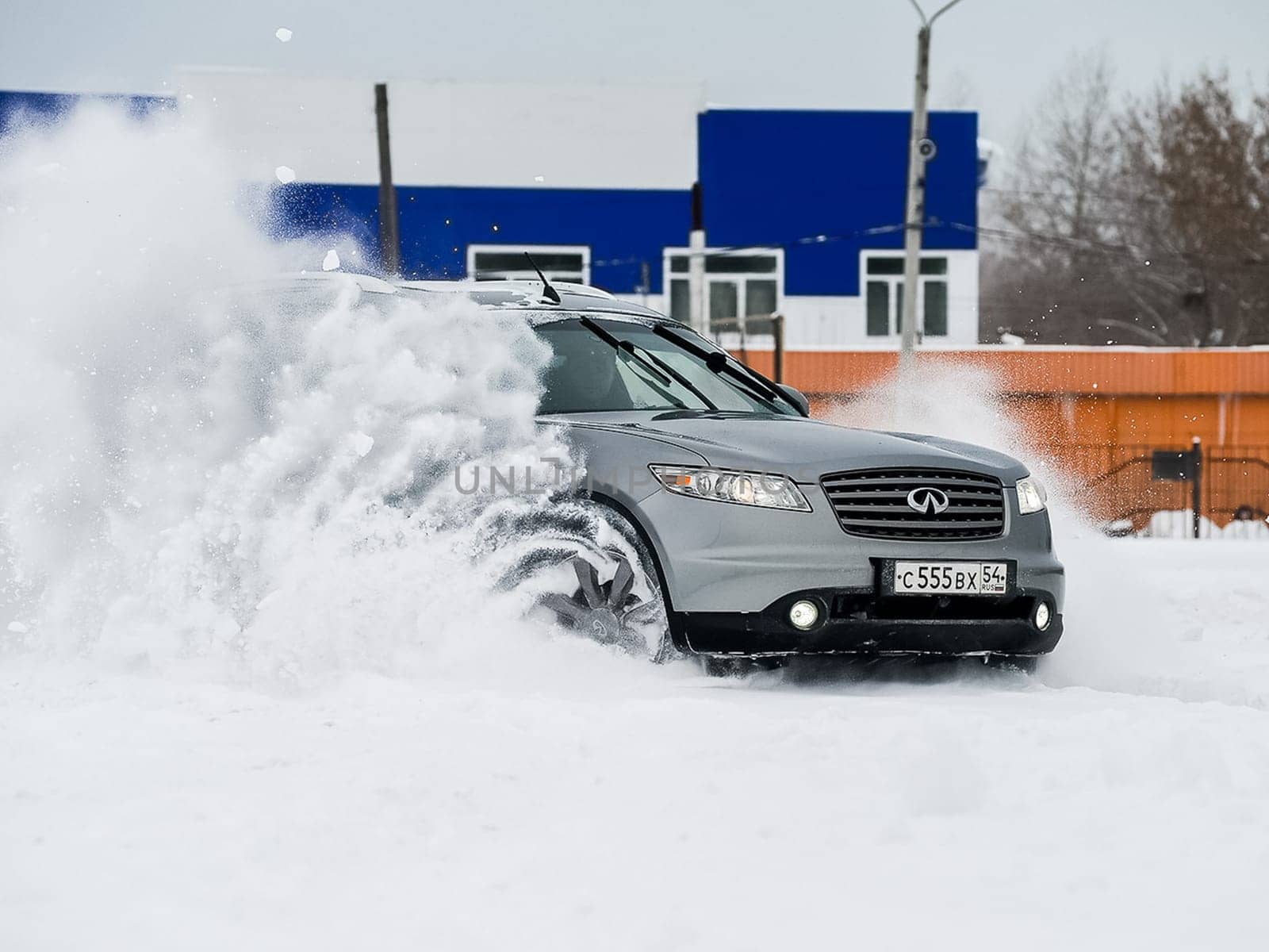 Moscow, Russia - January 24, 2019: Car infiniti QX70, winter photos of the car when driving through snowdrifts.