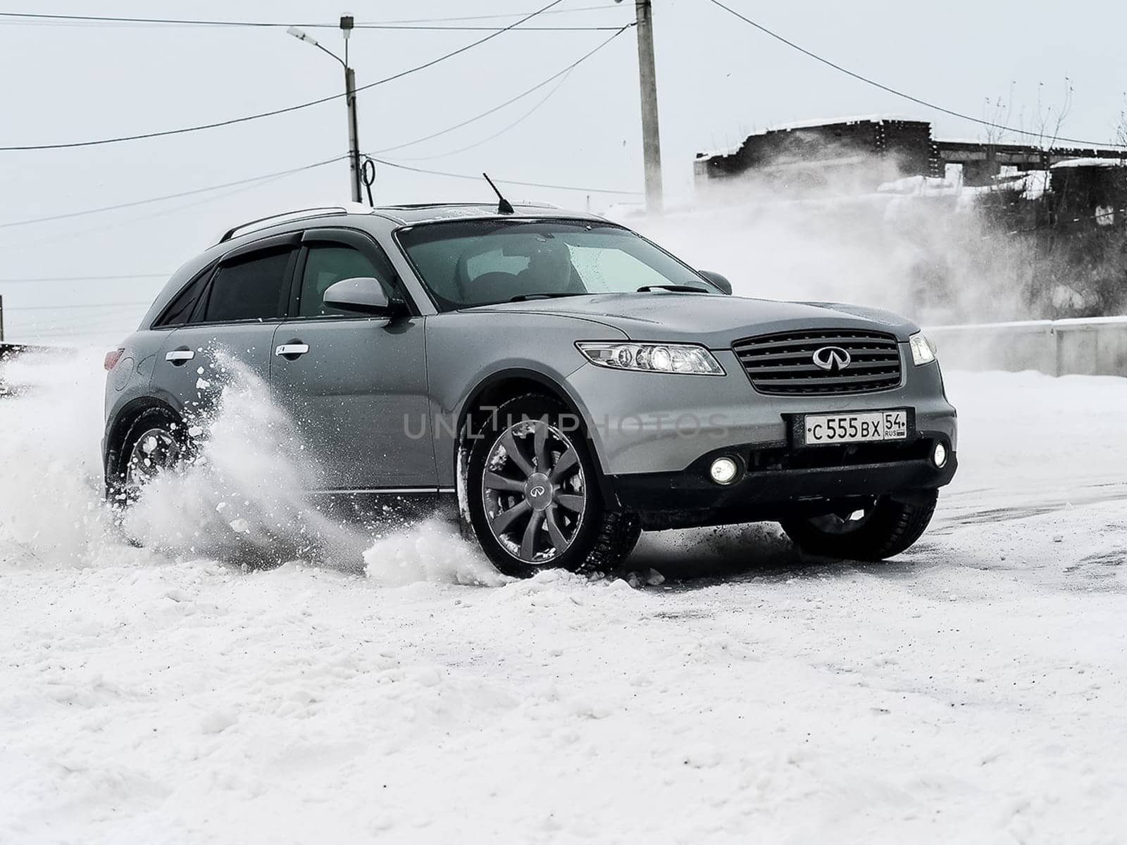 Moscow, Russia - January 24, 2019: Car infiniti QX70, winter photos of the car when driving through snowdrifts.