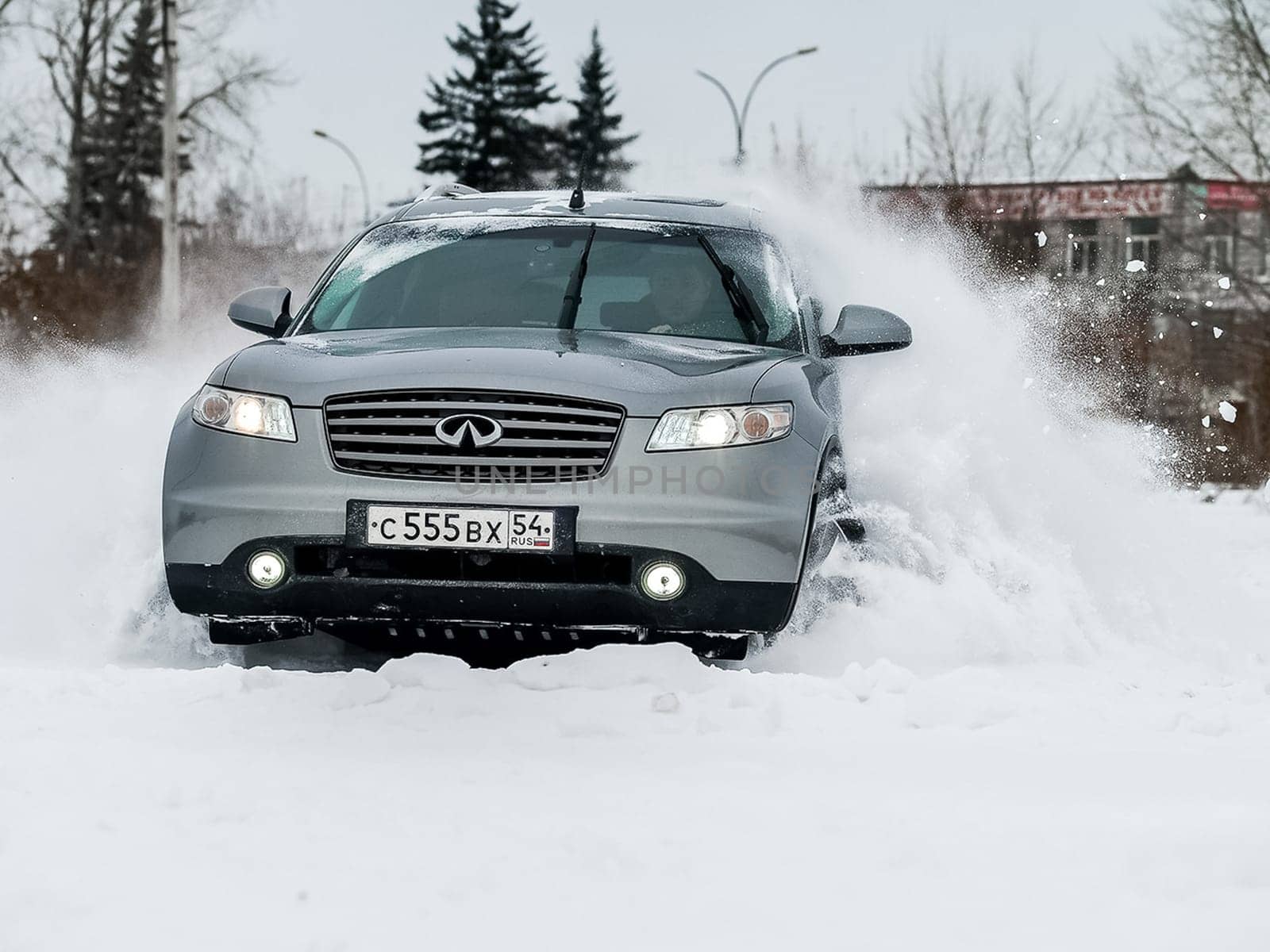 Moscow, Russia - January 24, 2019: Car infiniti QX70, winter photos of the car when driving through snowdrifts.
