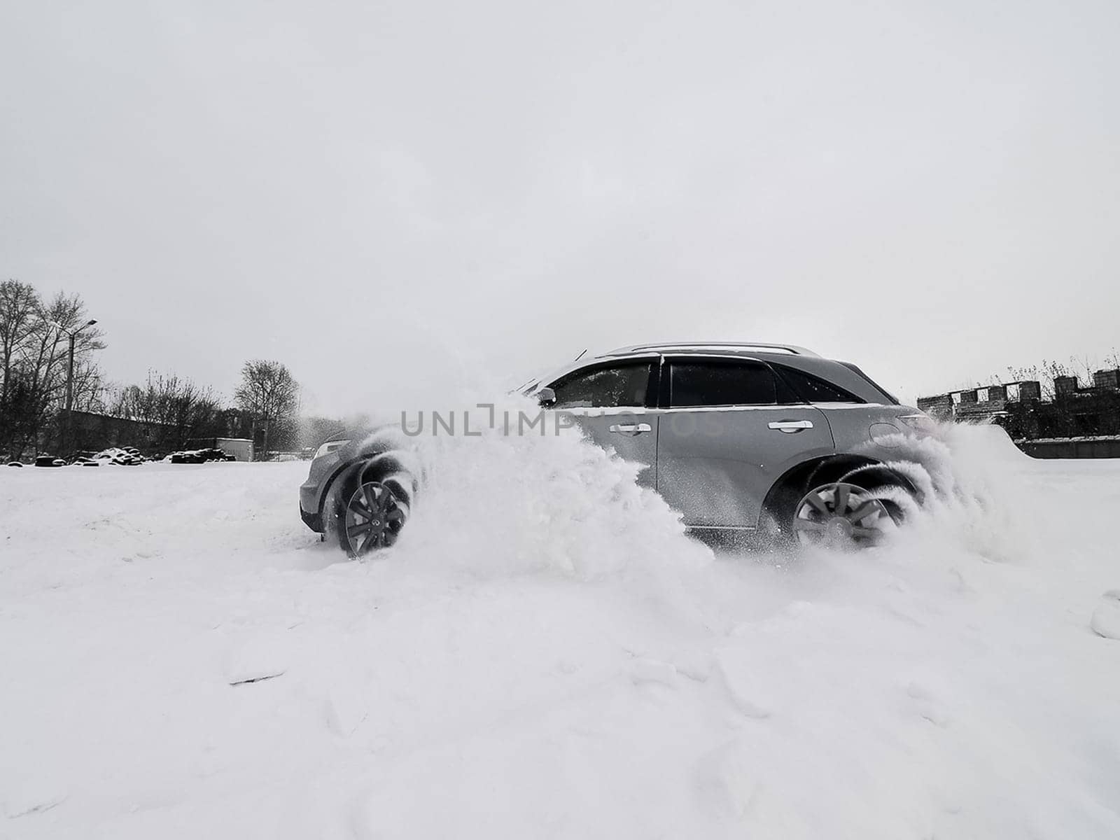 Moscow, Russia - January 24, 2019: Car infiniti QX70, winter photos of the car when driving through snowdrifts.
