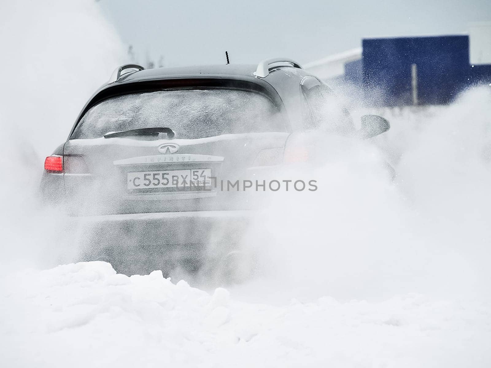 Moscow, Russia - January 24, 2019: Car infiniti QX70, winter photos of the car when driving through snowdrifts.
