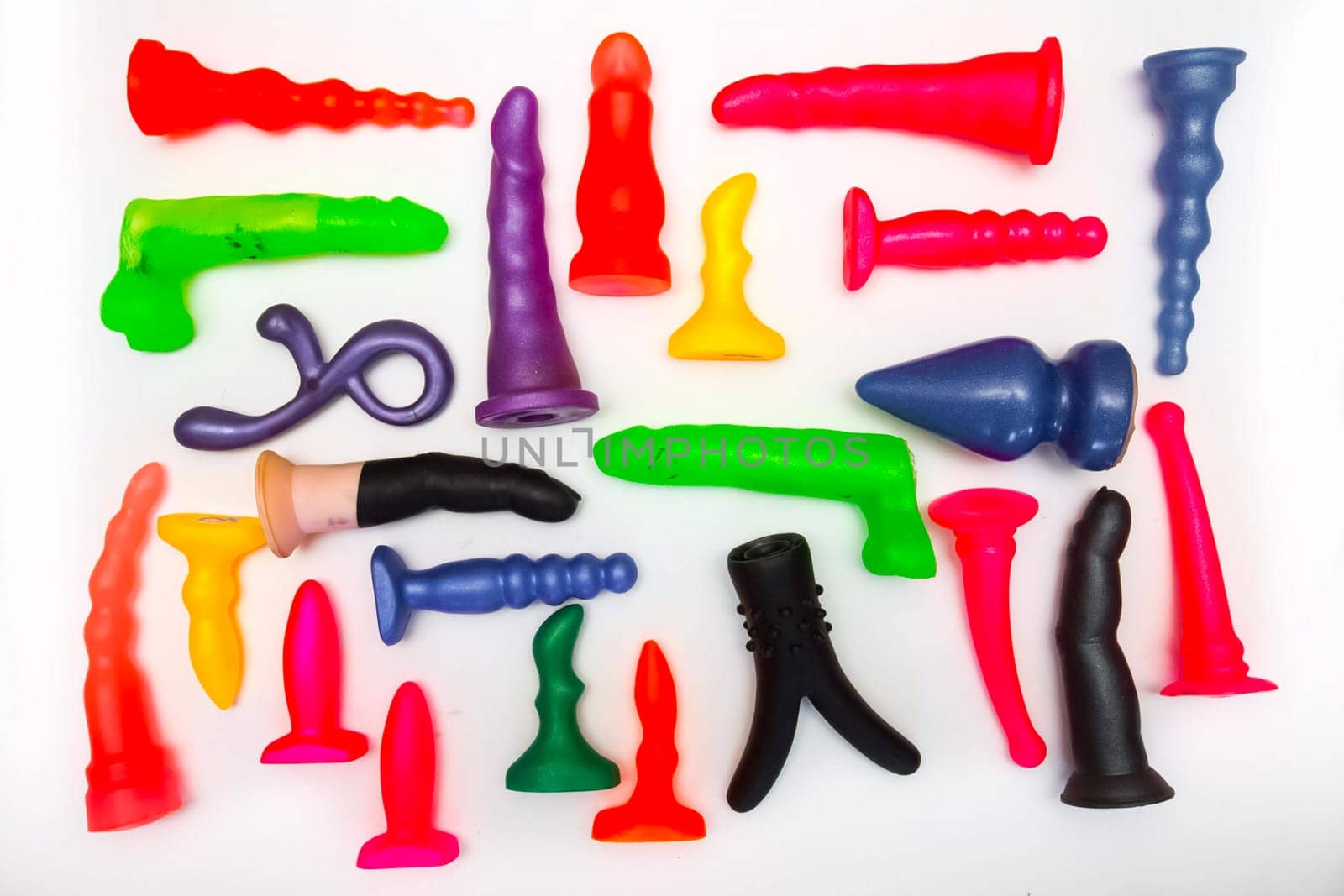 Sex toys on a white background. Products of a rubber products factory for a sex shop