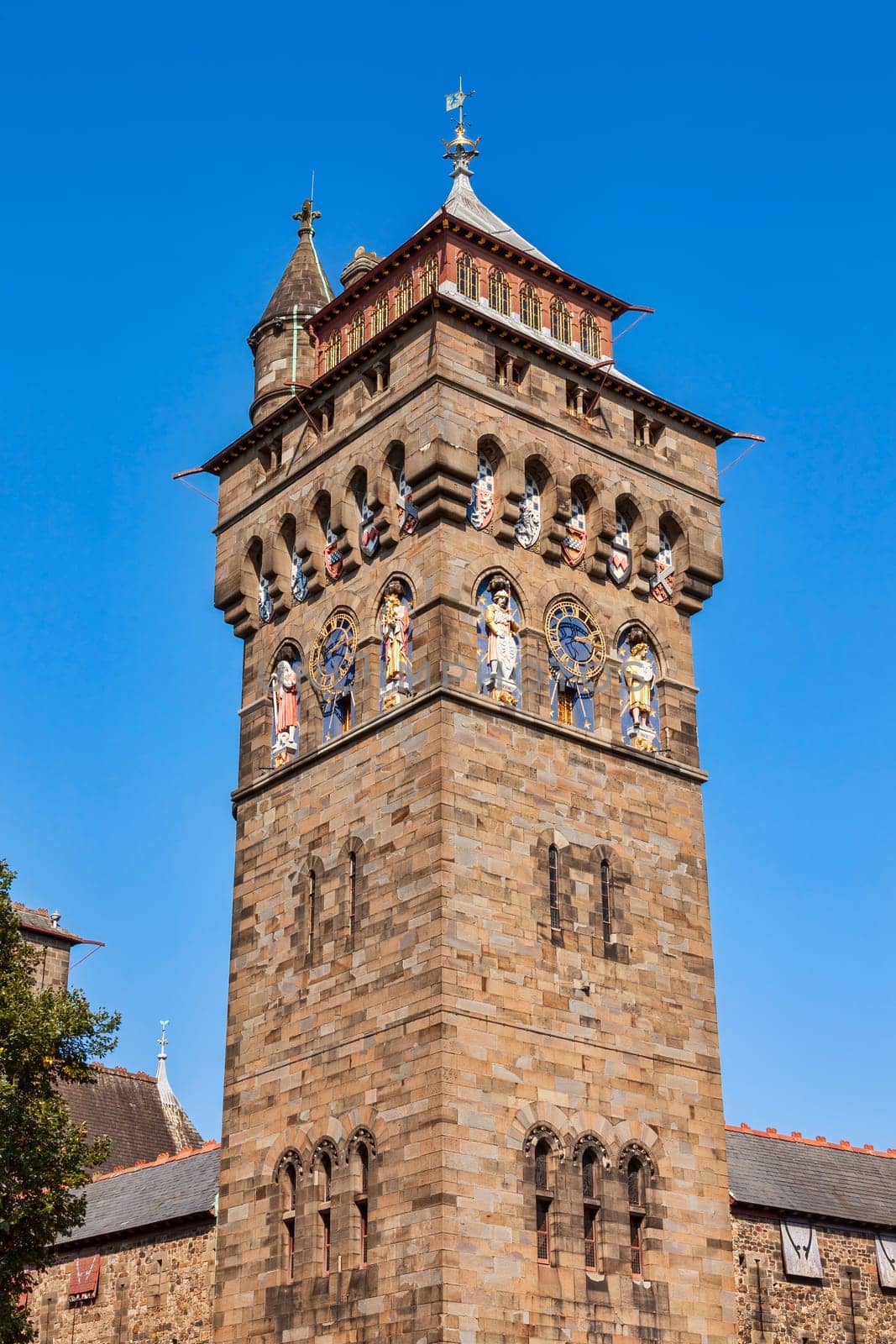 The clock tower of Cardiff Castle Wales UK completed in 1873 which is part of the wall of the 12th century Norman fort which is a popular tourism travel destination attraction landmark of the city