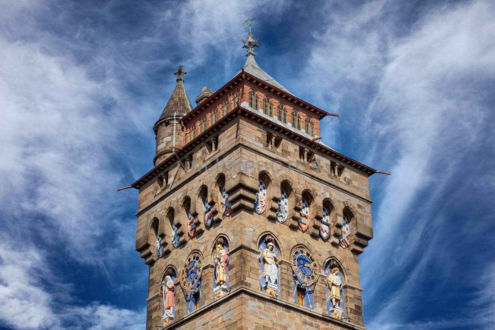 The clock tower of Cardiff Castle Wales UK completed in 1873 which is part of the wall of the 12th century Norman fort which is a popular tourism travel destination attraction landmark of the city