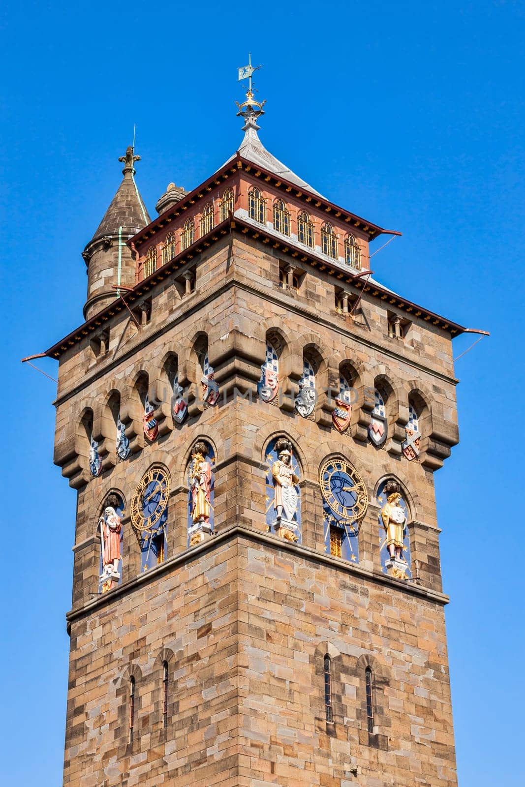 The clock tower of Cardiff Castle Wales UK completed in 1873 which is part of the wall of the 12th century Norman fort which is a popular tourism travel destination attraction landmark of the city