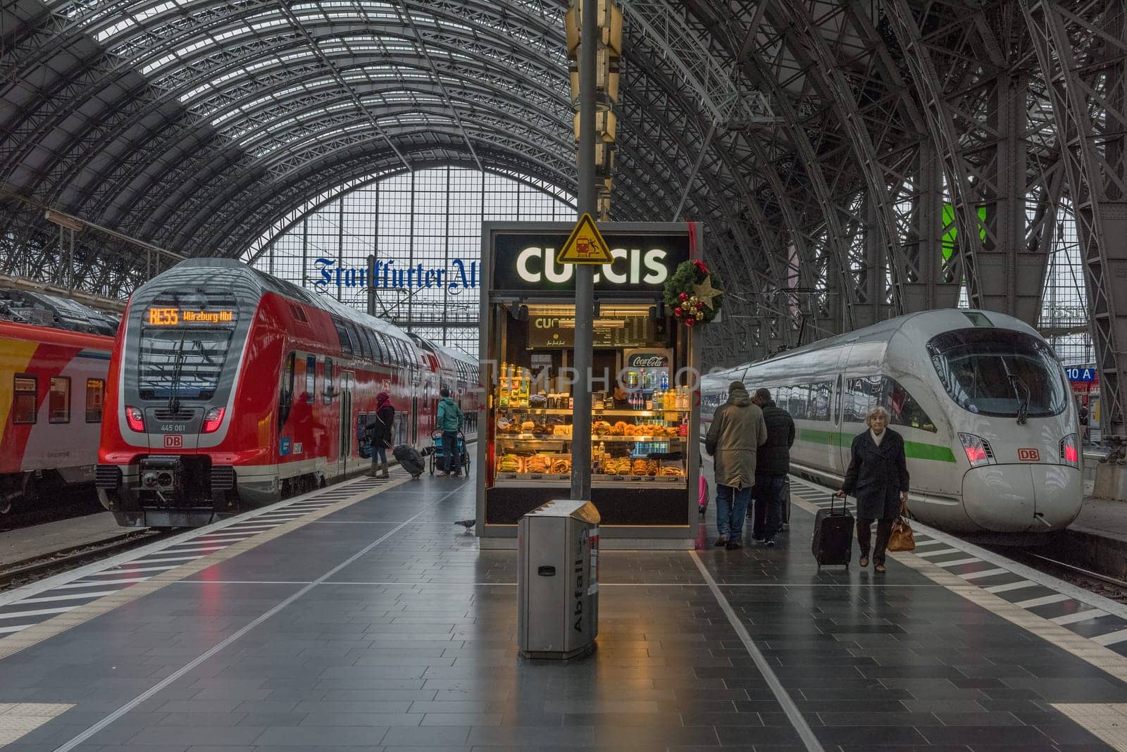 Trains and unidentified passengers in the central station of Frankfurt am Main, Germany