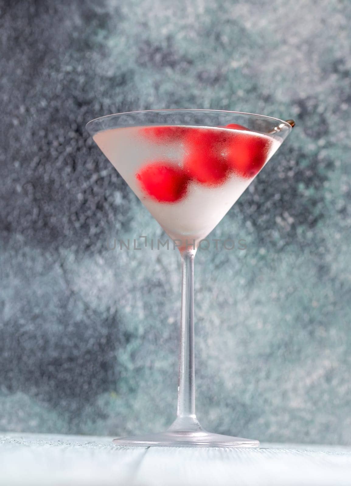 Glass of Dry Martini with red olives