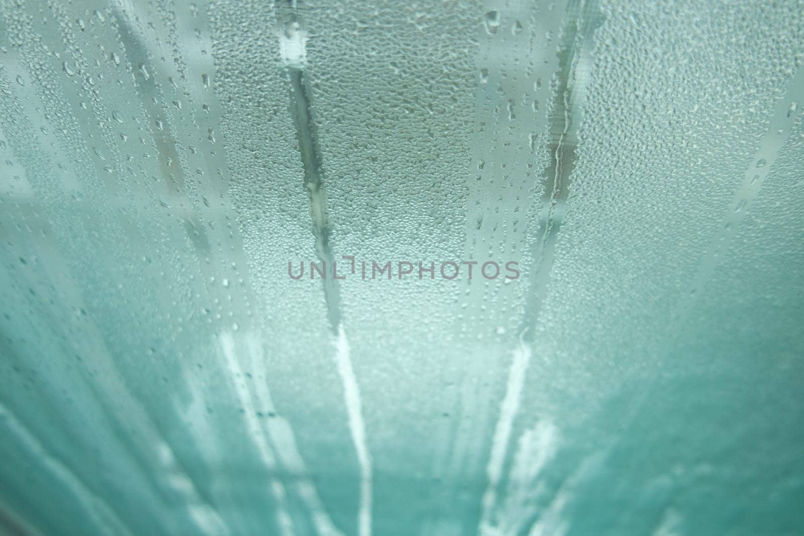 Bright grey color glassy texture, with water drops on it. Water drop glassy background