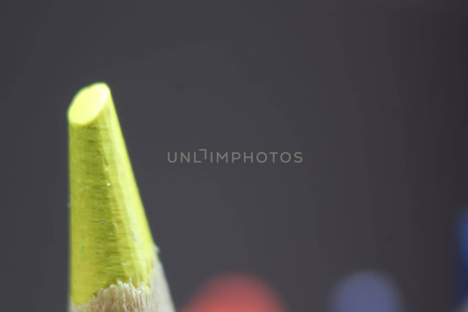 close up of sharpened pencil.Macro view of the tip of the pencil on a black background.