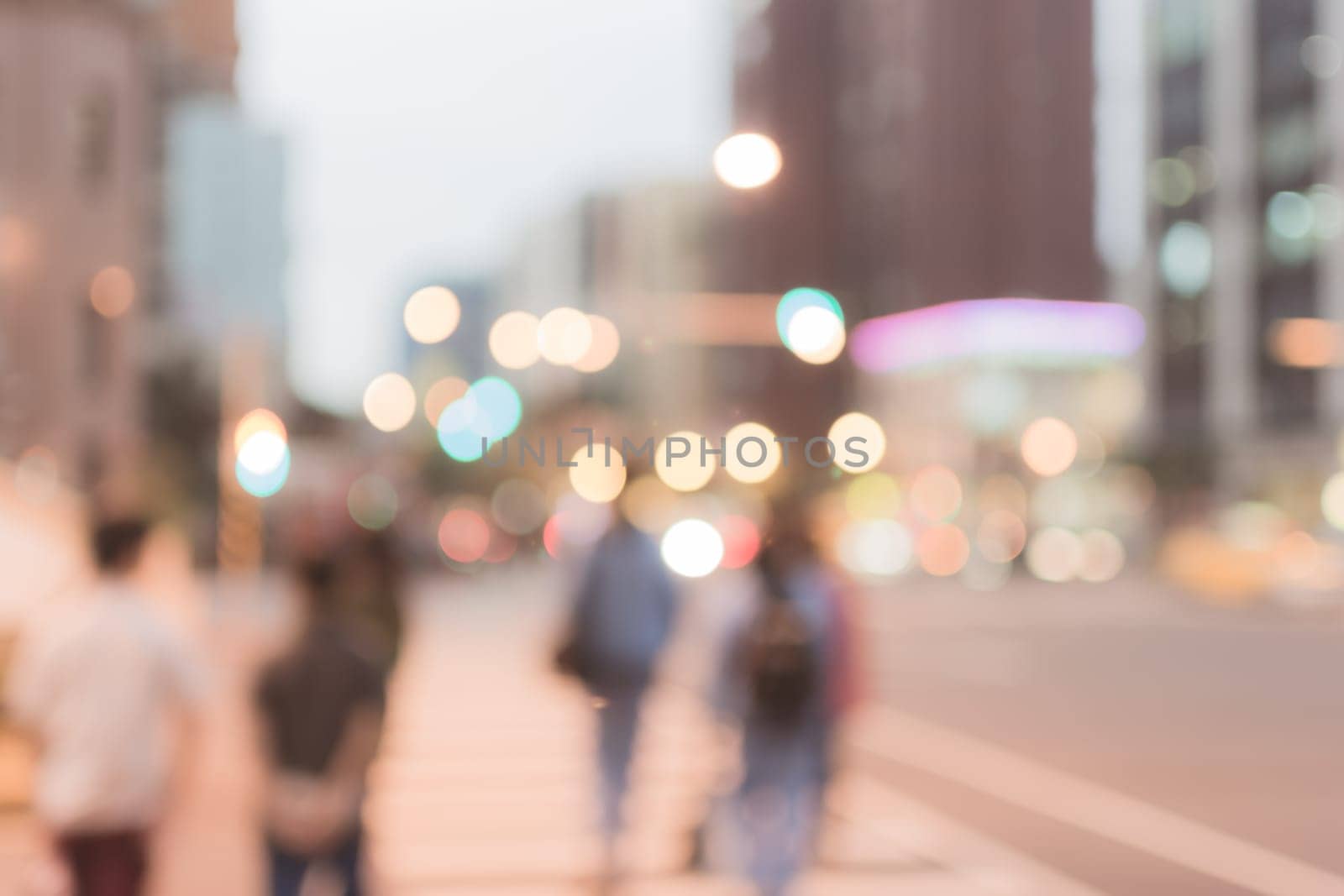 Abstract urban background with blurred buildings and street, shallow depth of focus.