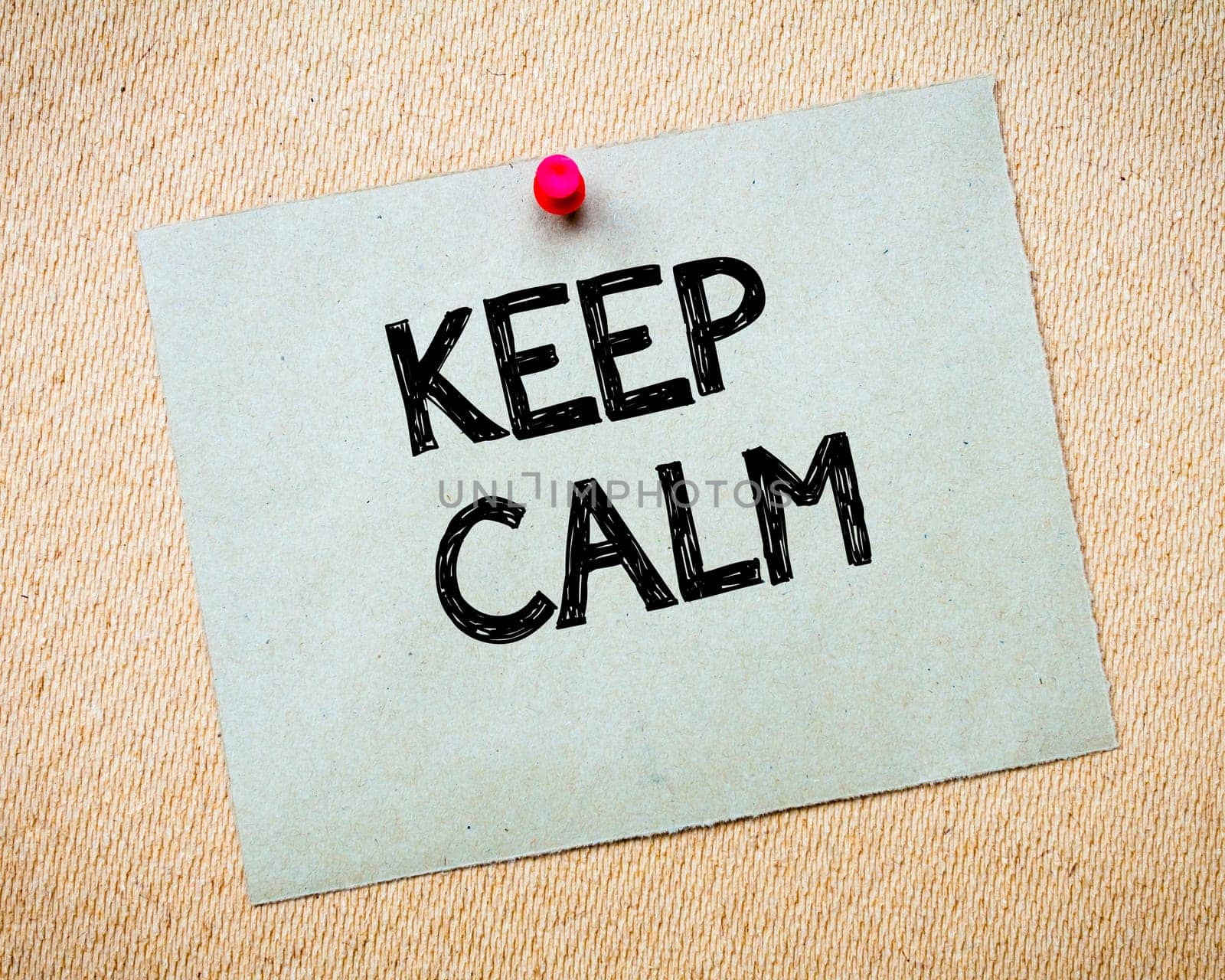 Recycled paper note pinned on cork board. Keep Calm Message. Motivational Concept Image