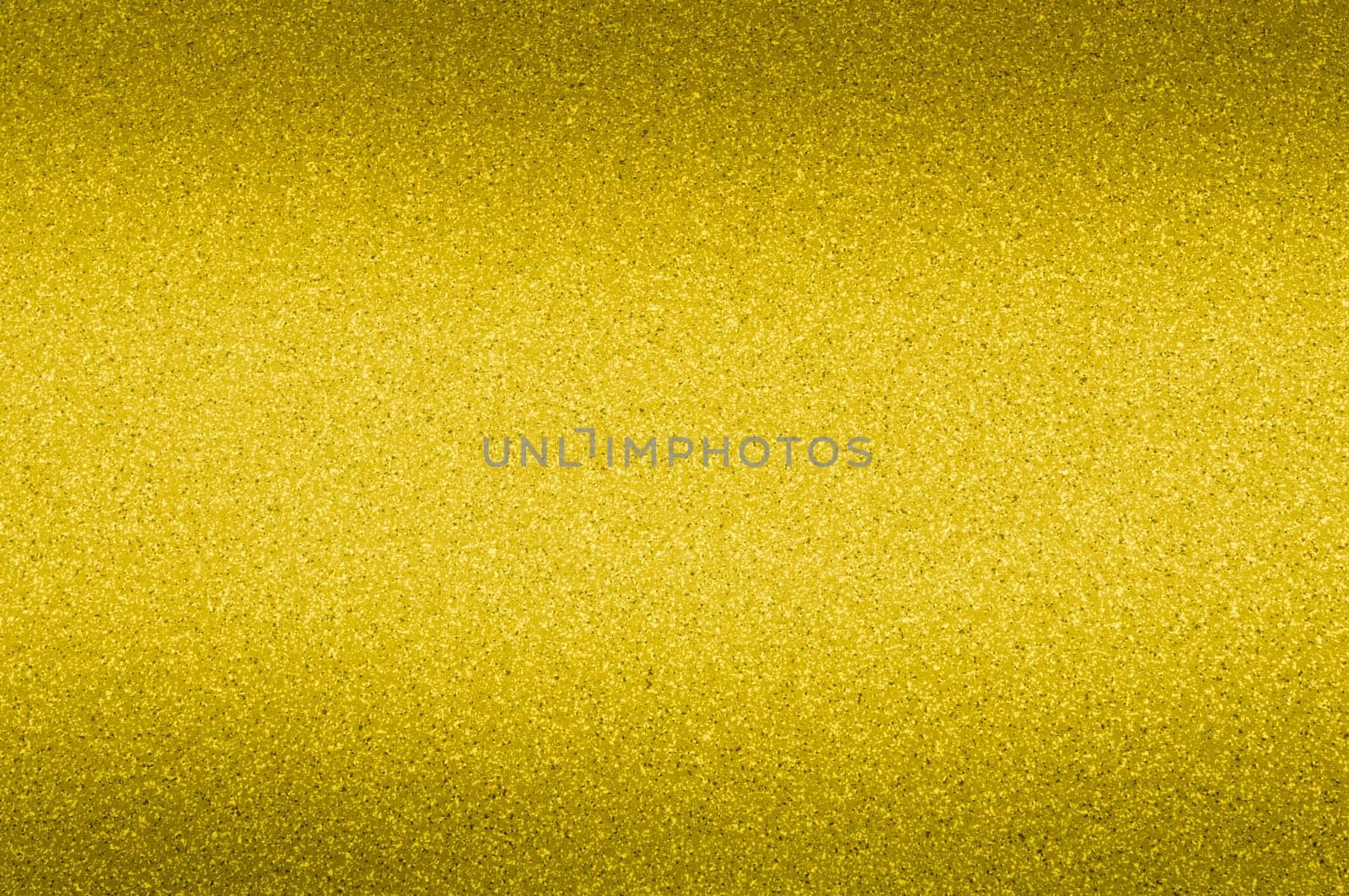 Granite background of golden color with small dots. Darkening.