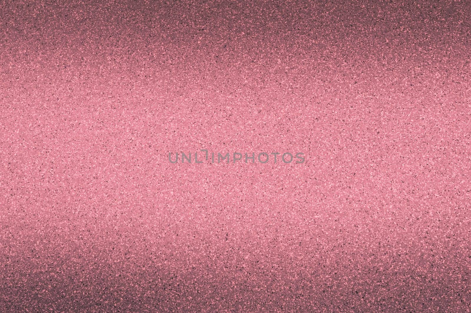 Granite background of red color with small dots.