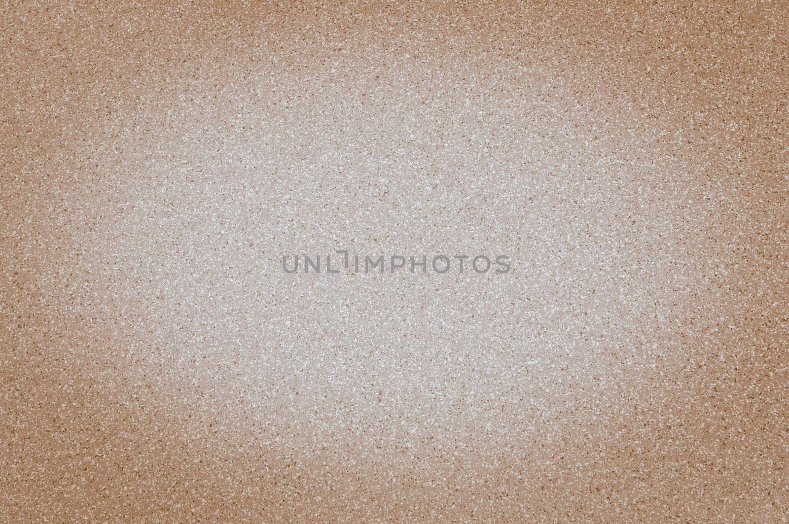 Texture of granite brown color with small dots, with vignetting.