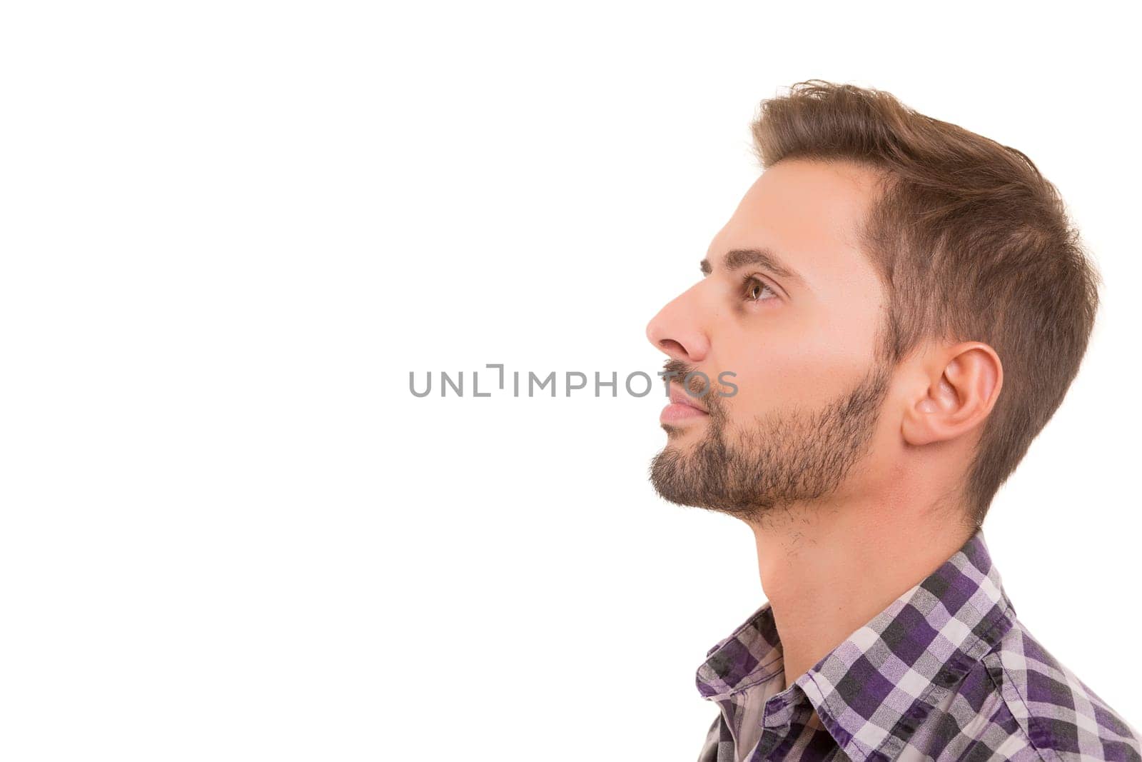 Studio picture of a young and handsome man posing isolated