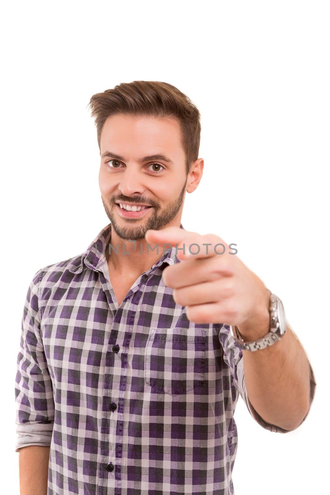 Handsome young man pointing at you, isolated over white background