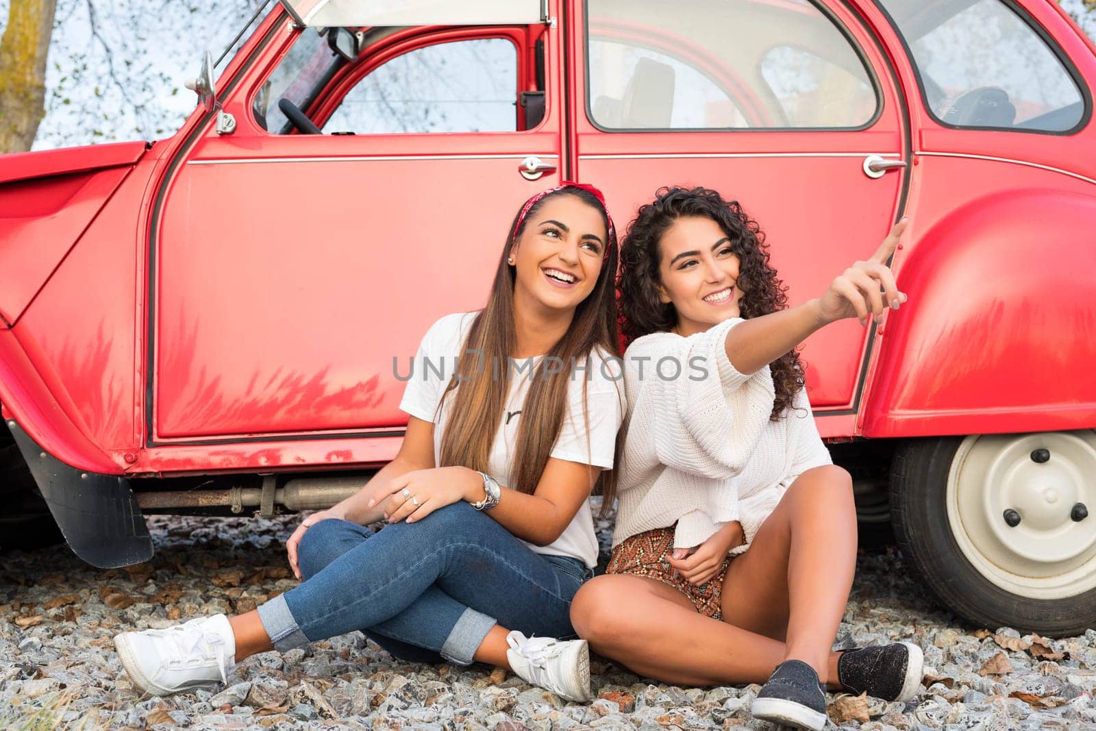 Two friends going on a roadtrip through countryside