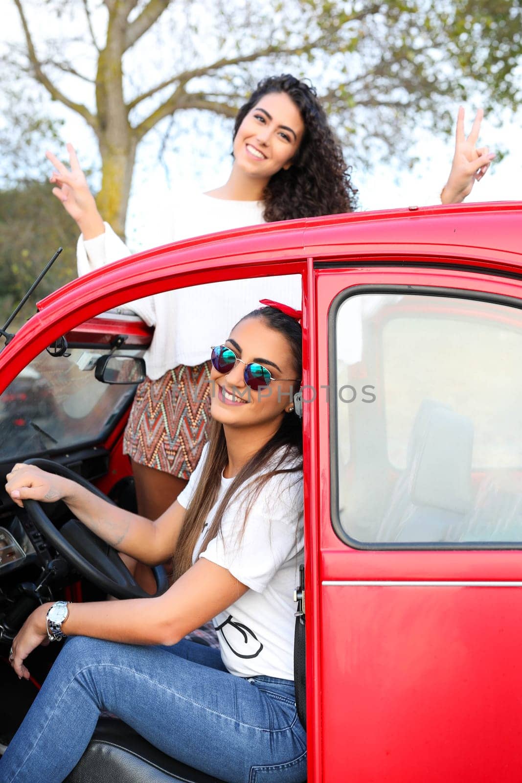 Two friends going on a roadtrip through countryside