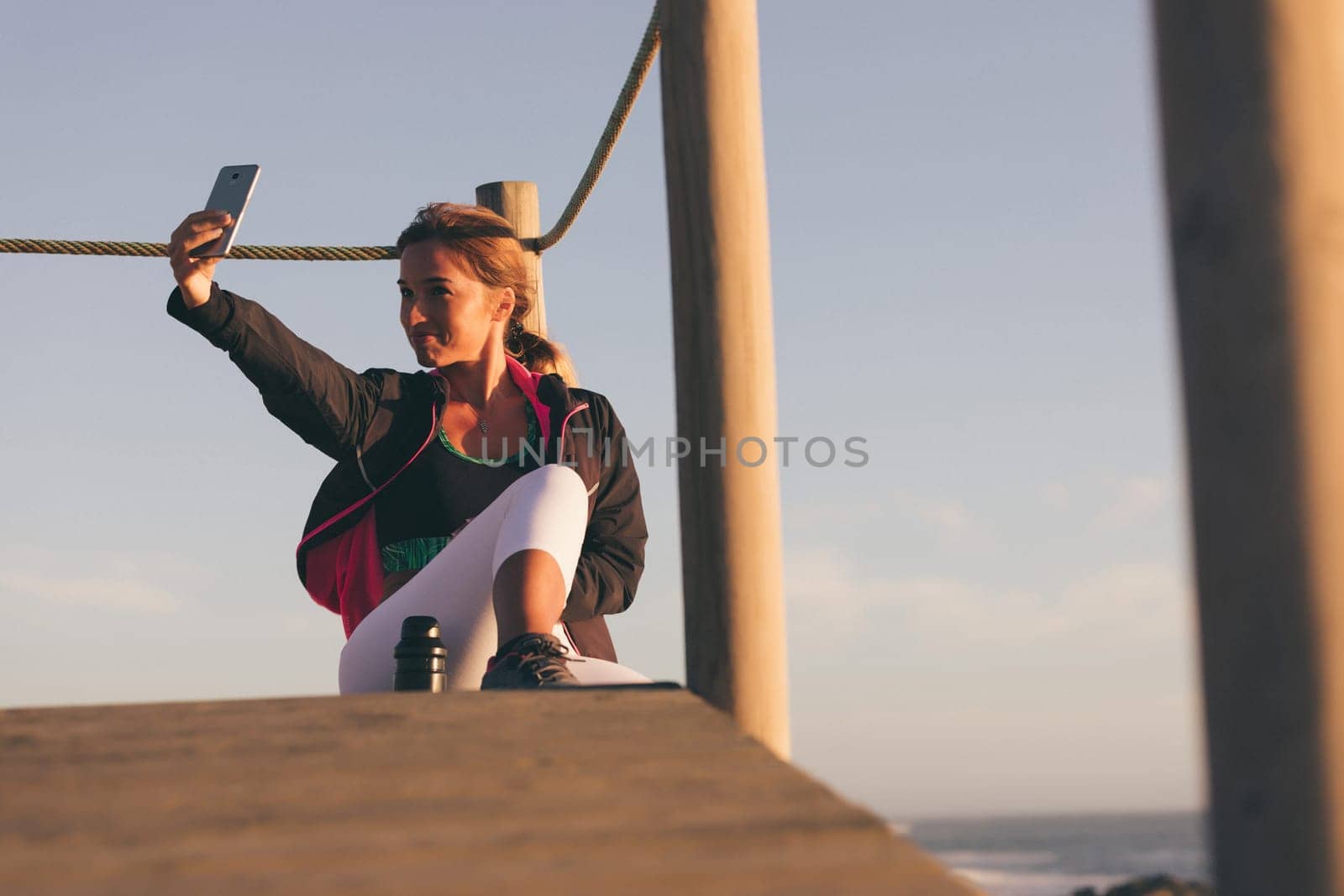 Beautiful young chinese woman taking a break from her workout