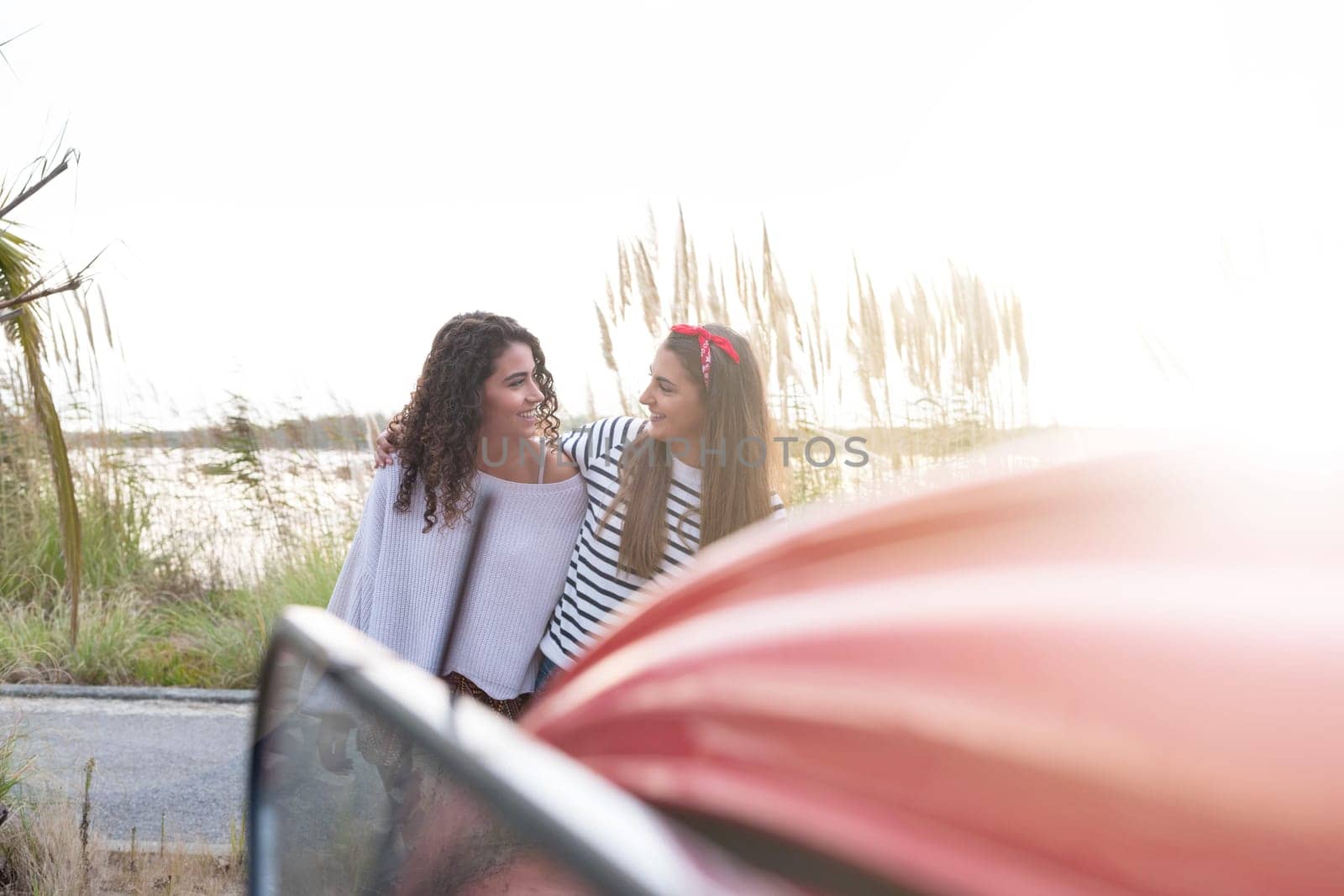 Two friends going on a roadtrip through countryside