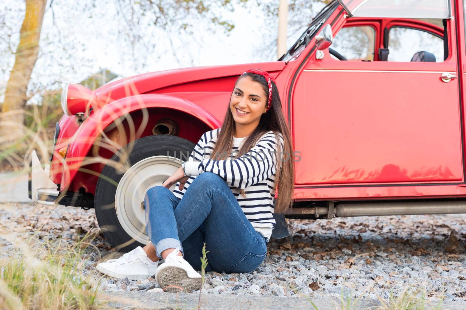 Woman going on a roadtrip in her convertible car