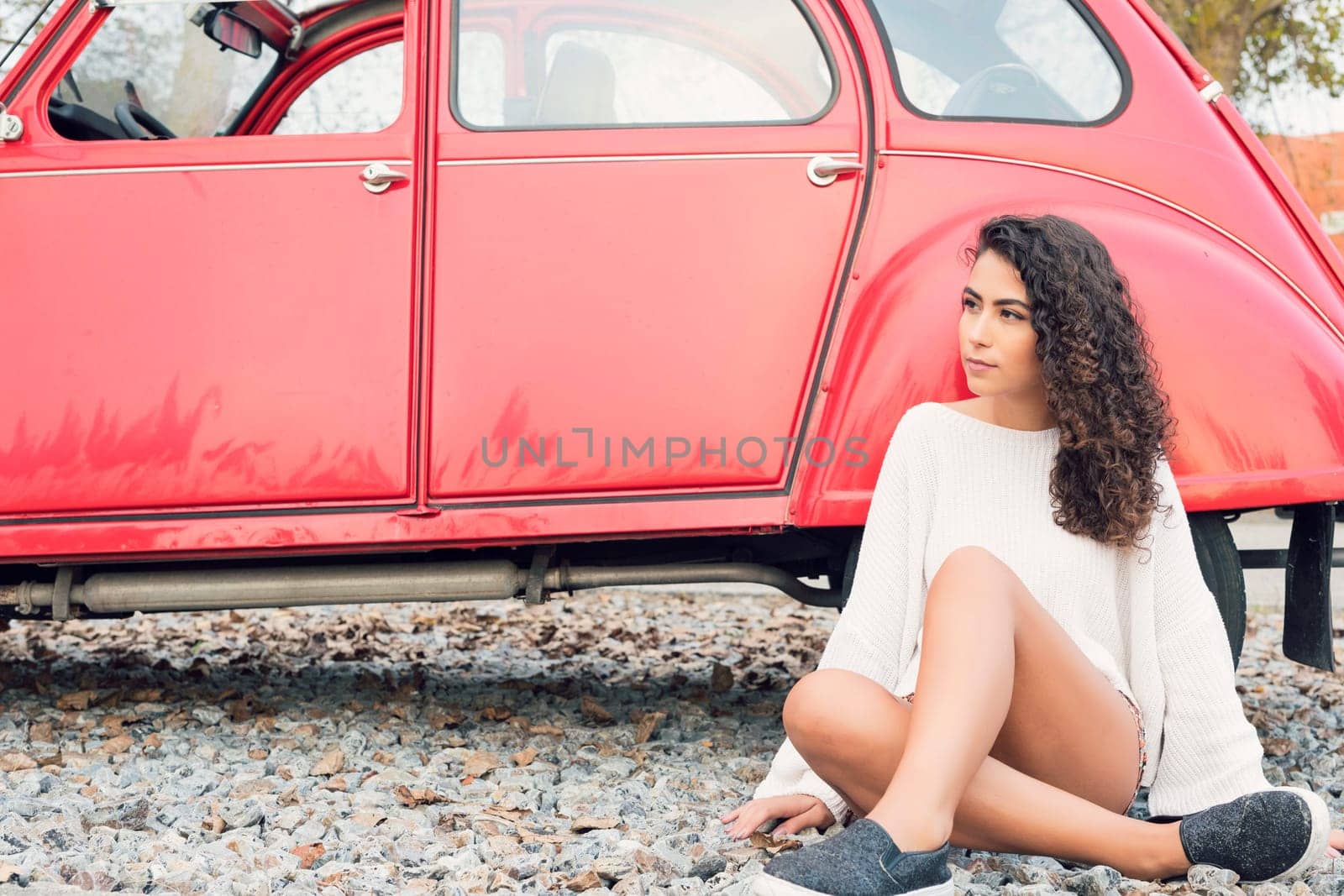 Woman going on a roadtrip in her convertible car