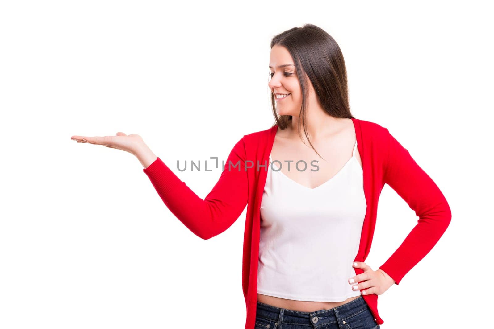 Young beautiful woman presenting your product, isolated over white background