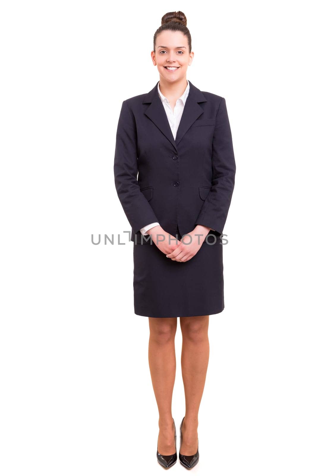 Beautiful young business woman posing isolated