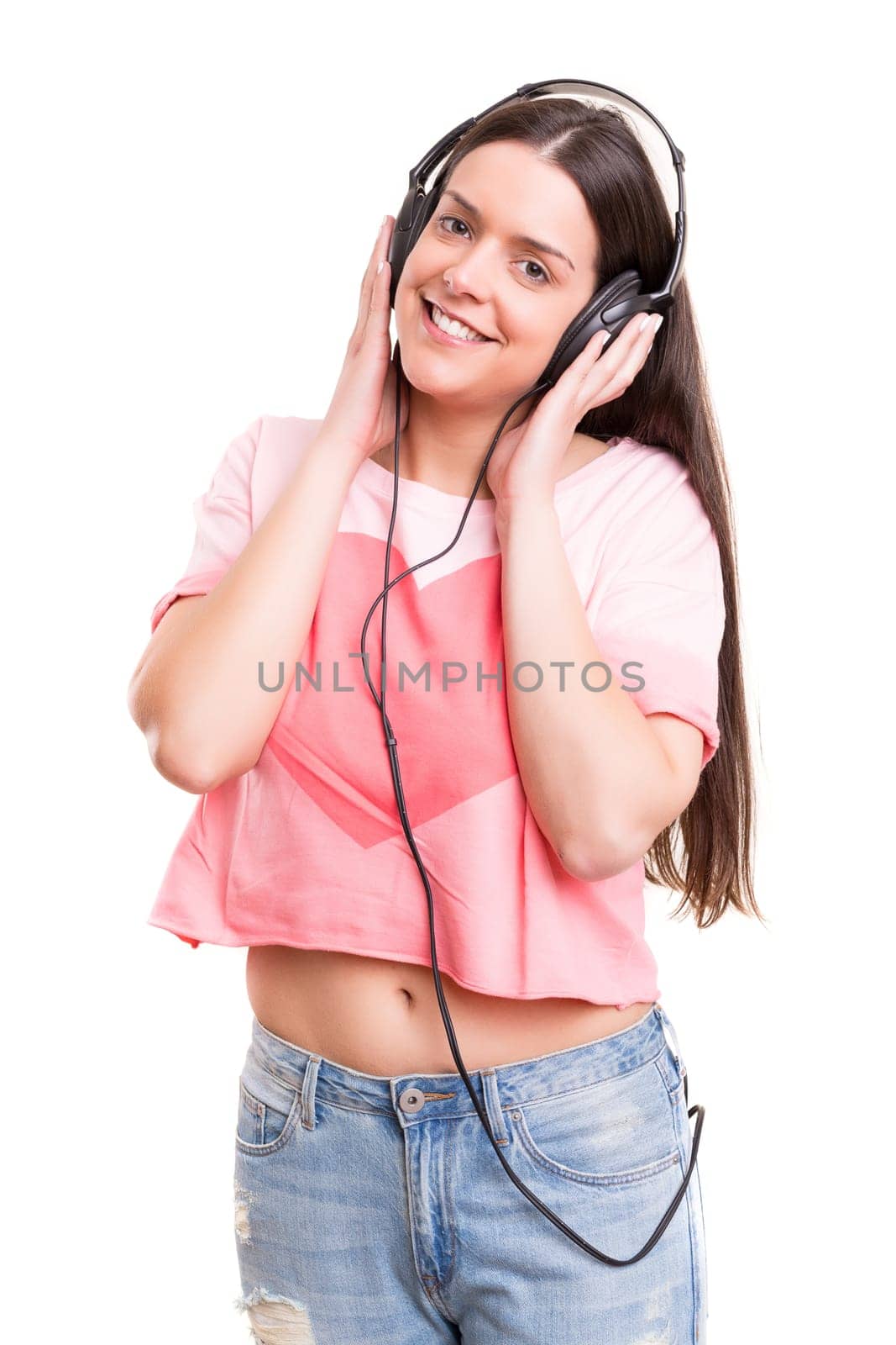 A Happy young woman listening to music