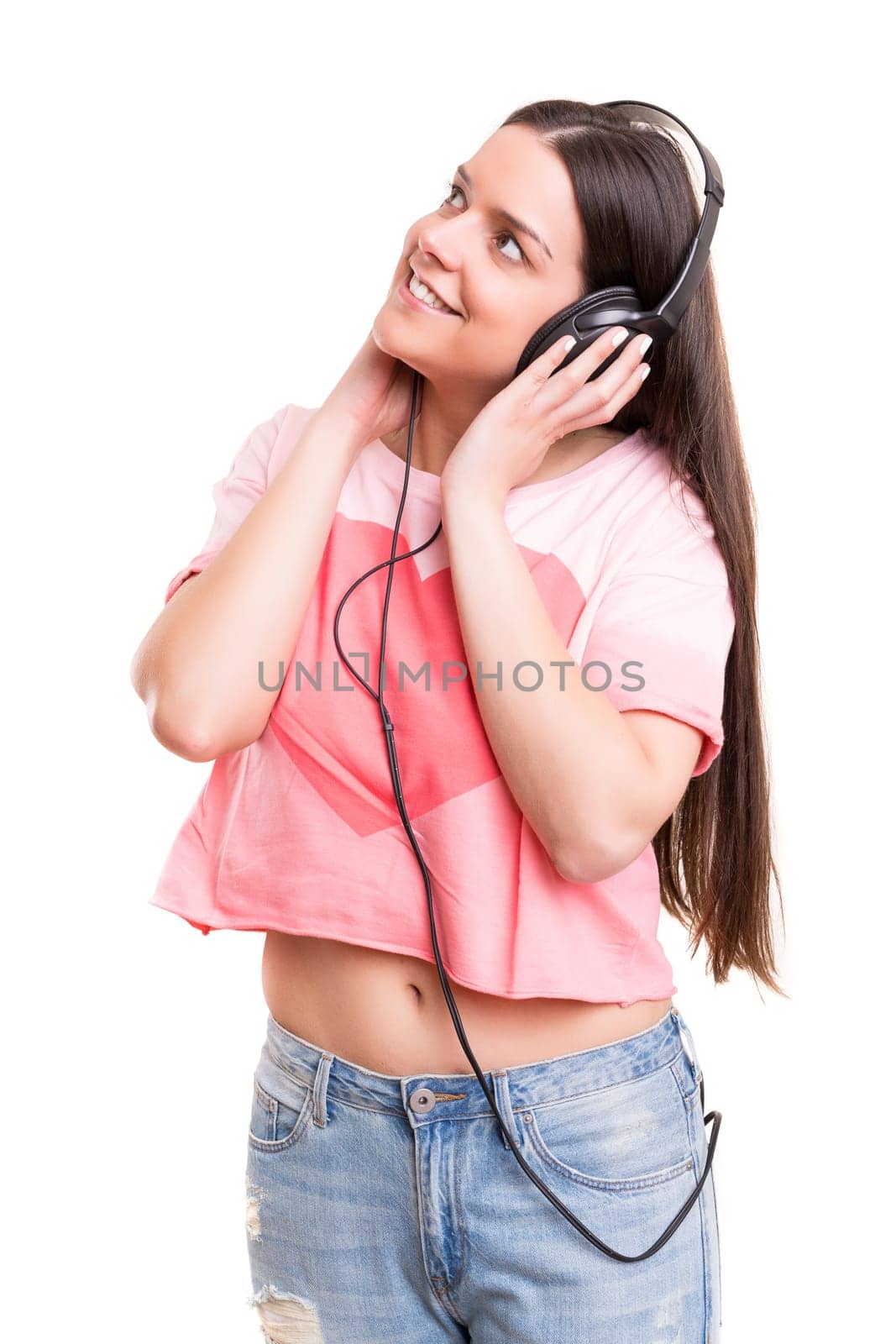 A Happy young woman listening to music