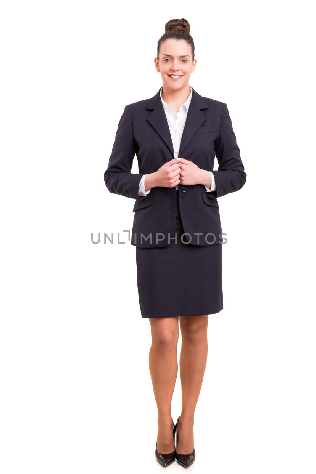 Beautiful young business woman posing isolated
