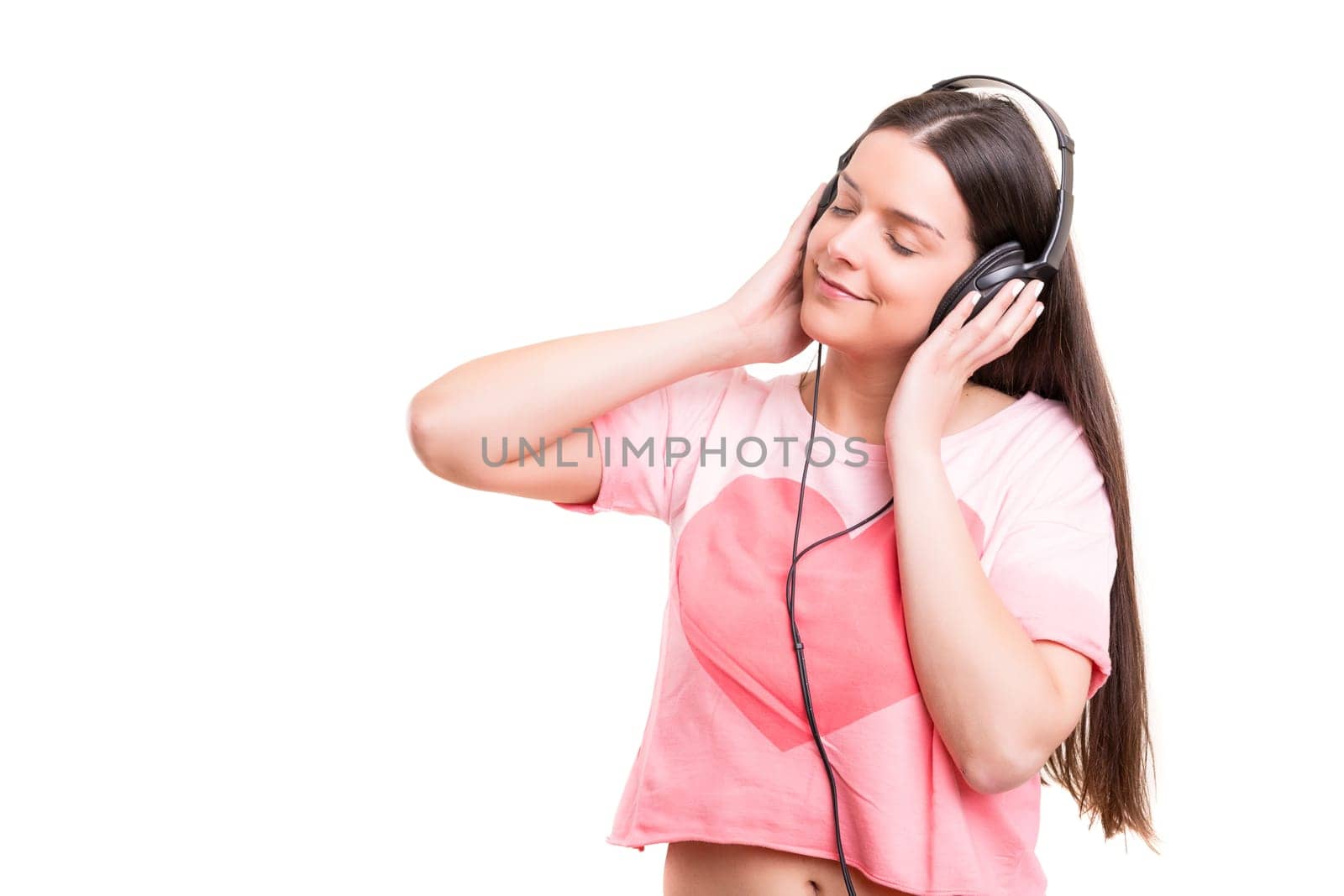 A Happy young woman listening to music