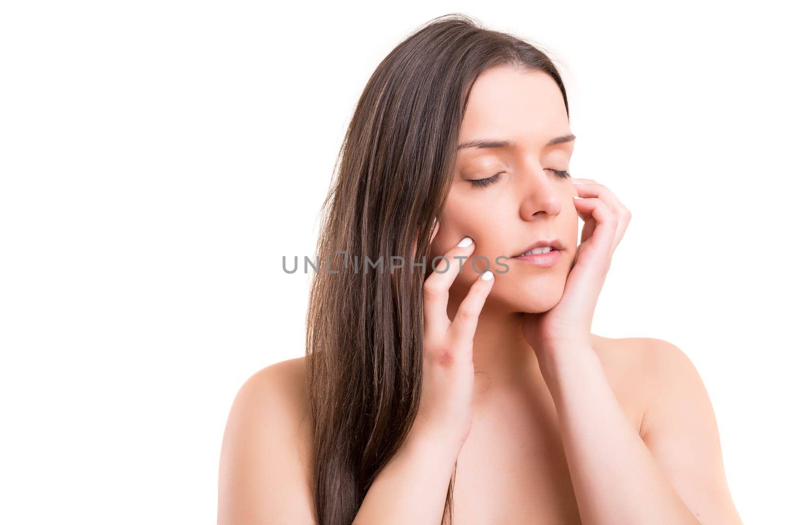 Beautiful woman with perfect skin posing over white