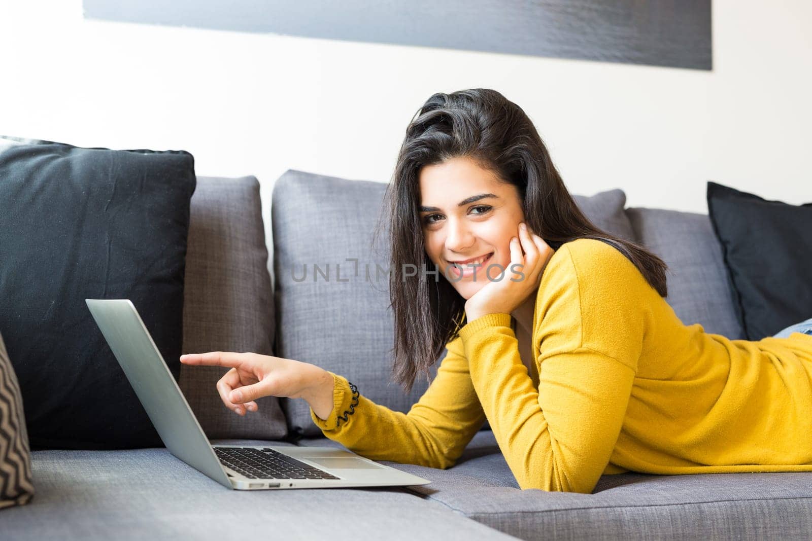 Beautiful woman relaxing with a computer