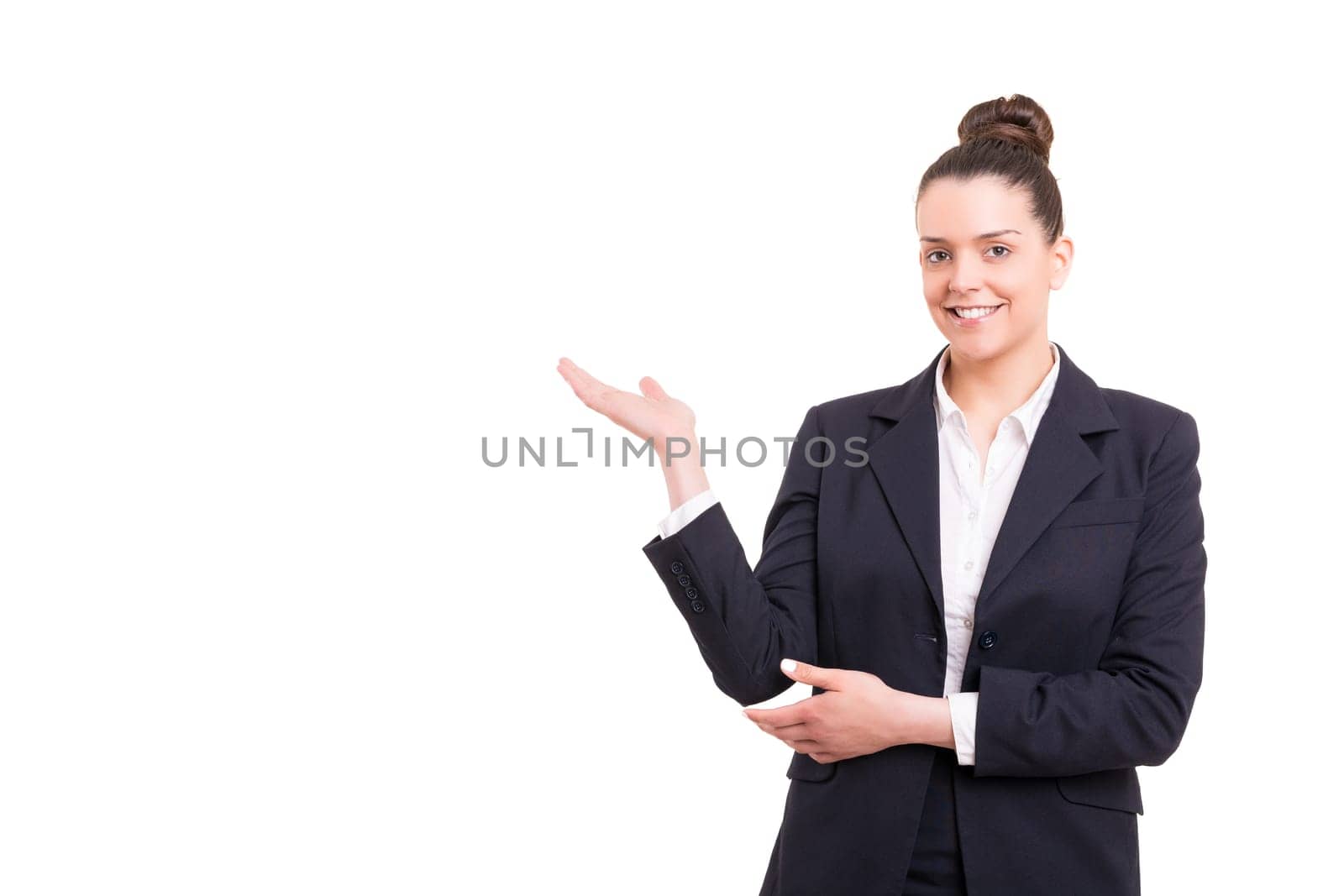 Young beautiful woman presenting your product, isolated over white background