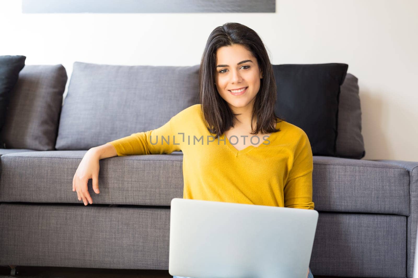 Beautiful woman relaxing with a computer