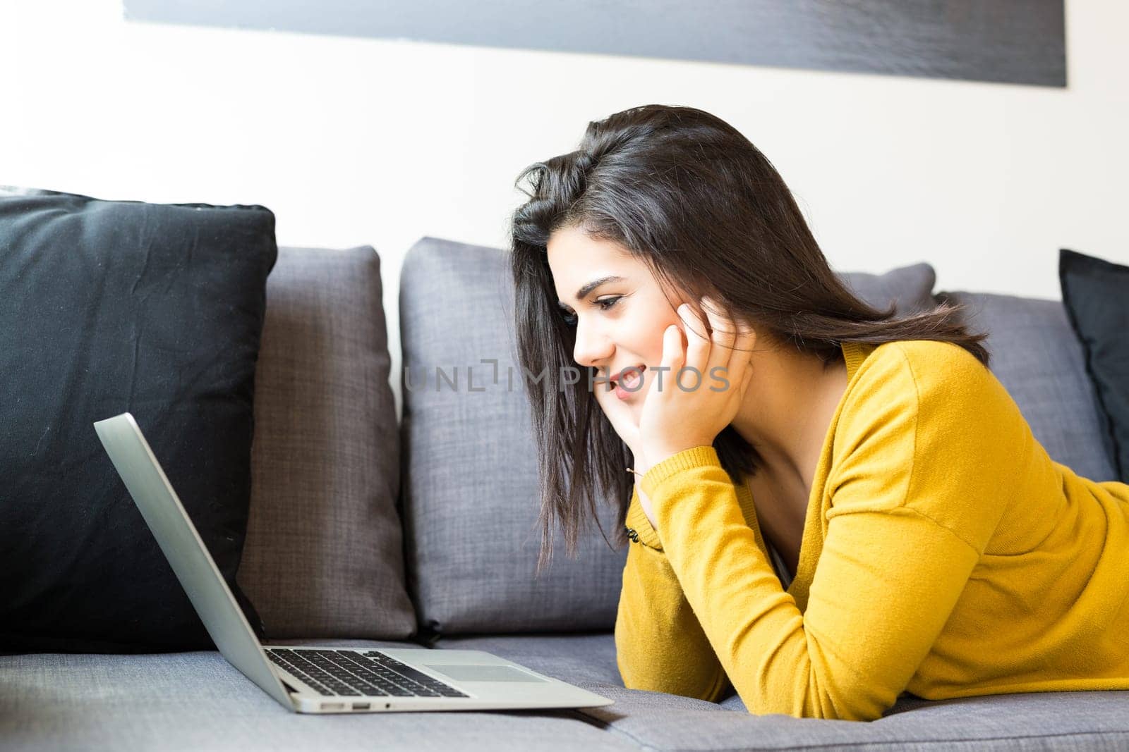 Beautiful woman relaxing with a computer