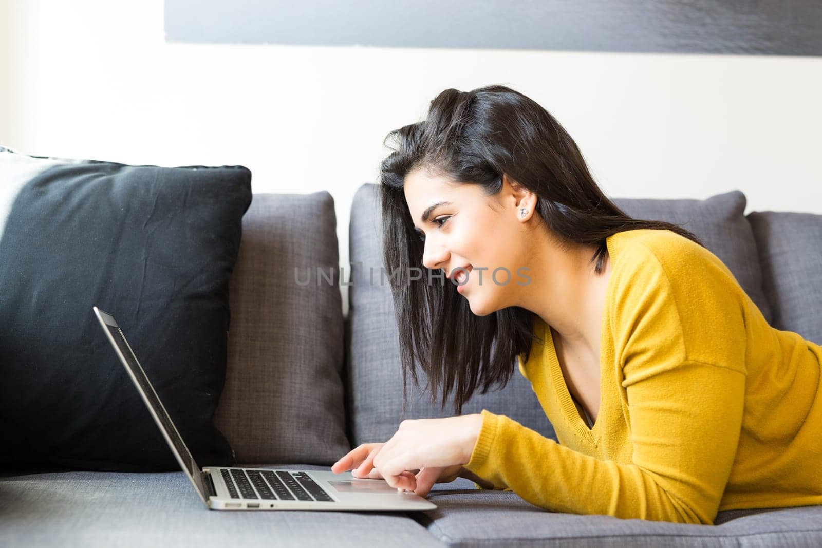 Beautiful woman relaxing with a computer